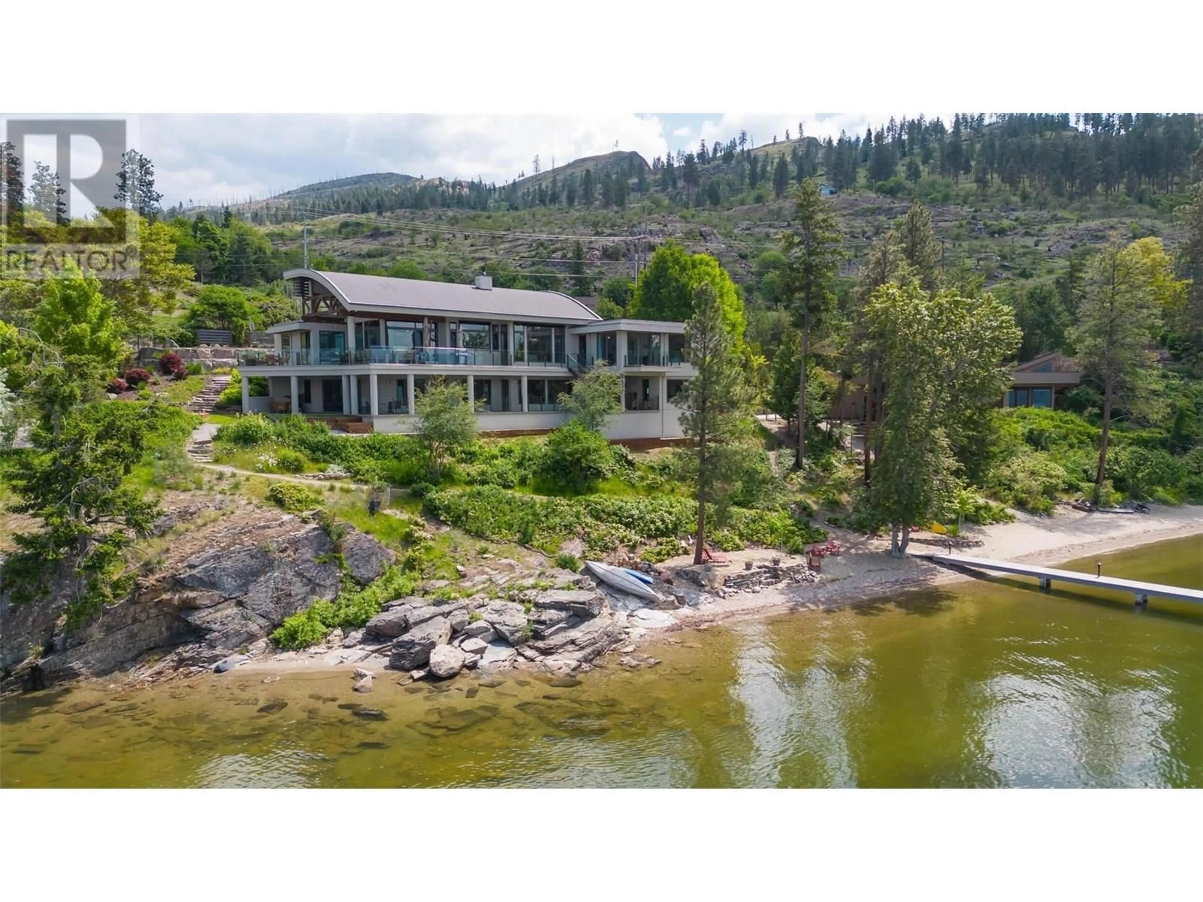 A pic from outside/outdoor area/front of a property/back of a property/a pic from drone, water/lake/river/ocean view for 5560 LAKESHORE ROAD, Kelowna British Columbia V1W4J4