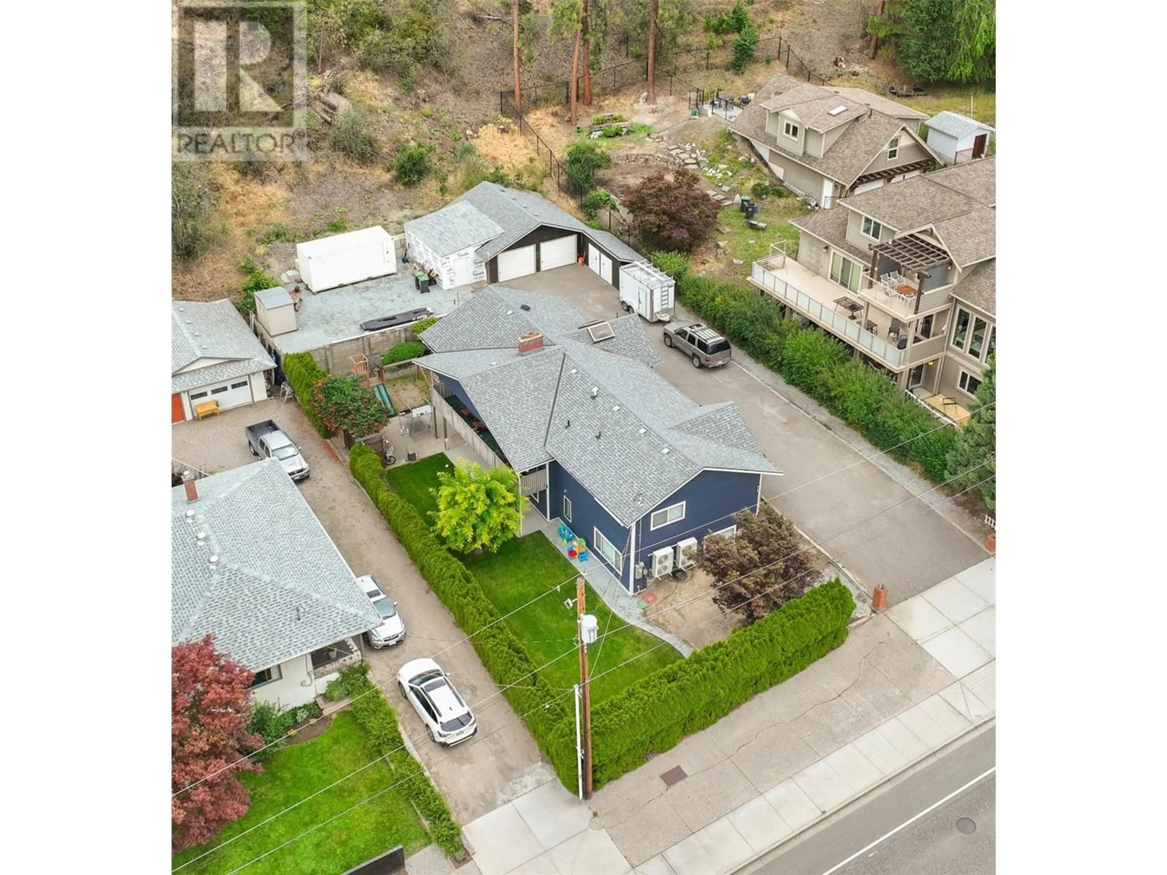 A pic from outside/outdoor area/front of a property/back of a property/a pic from drone, street for 868 CLIFTON ROAD, Kelowna British Columbia V1Y4C5