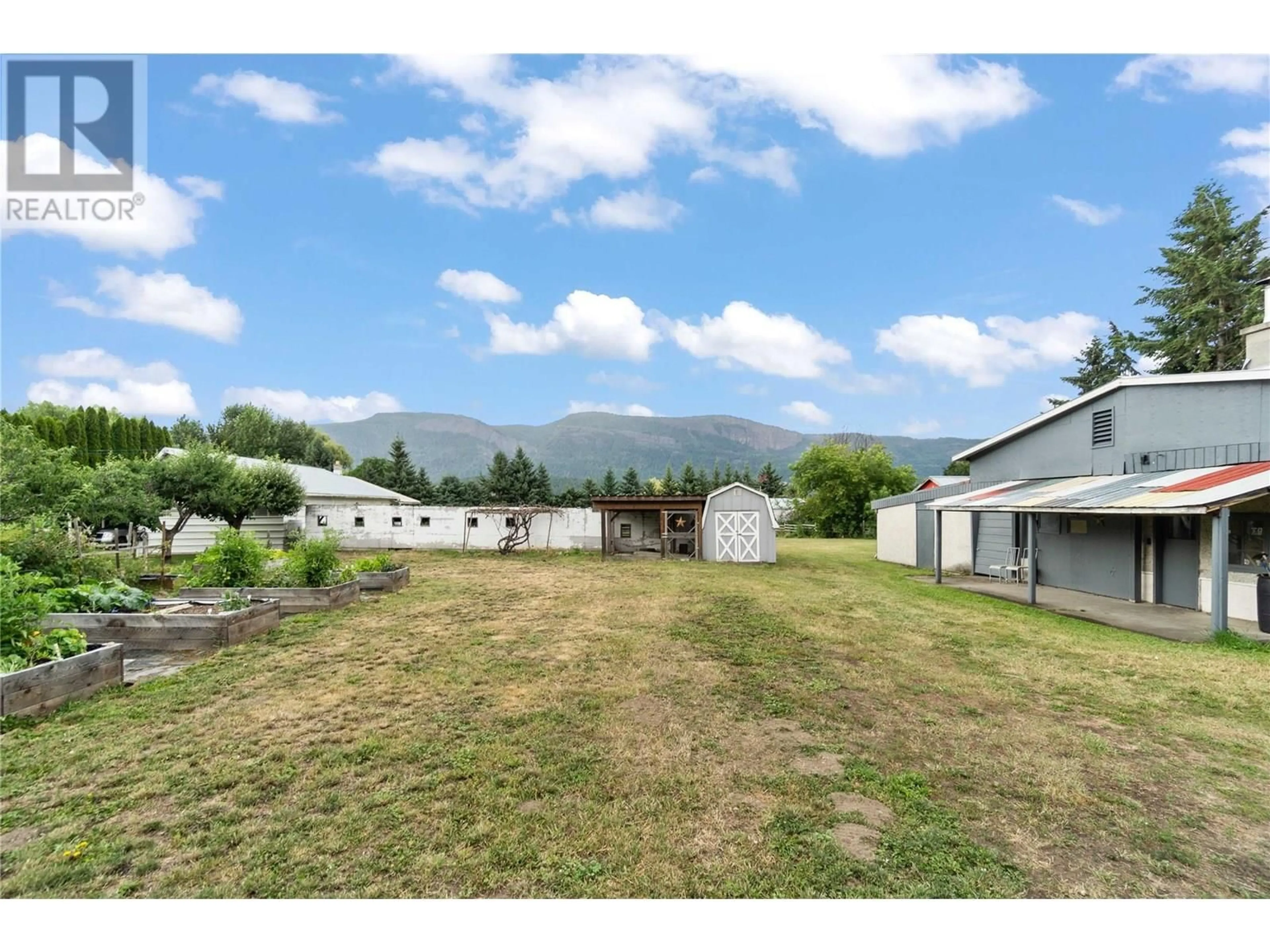 A pic from outside/outdoor area/front of a property/back of a property/a pic from drone, mountain view for 6591 97A HIGHWAY, Enderby British Columbia V0E1V3