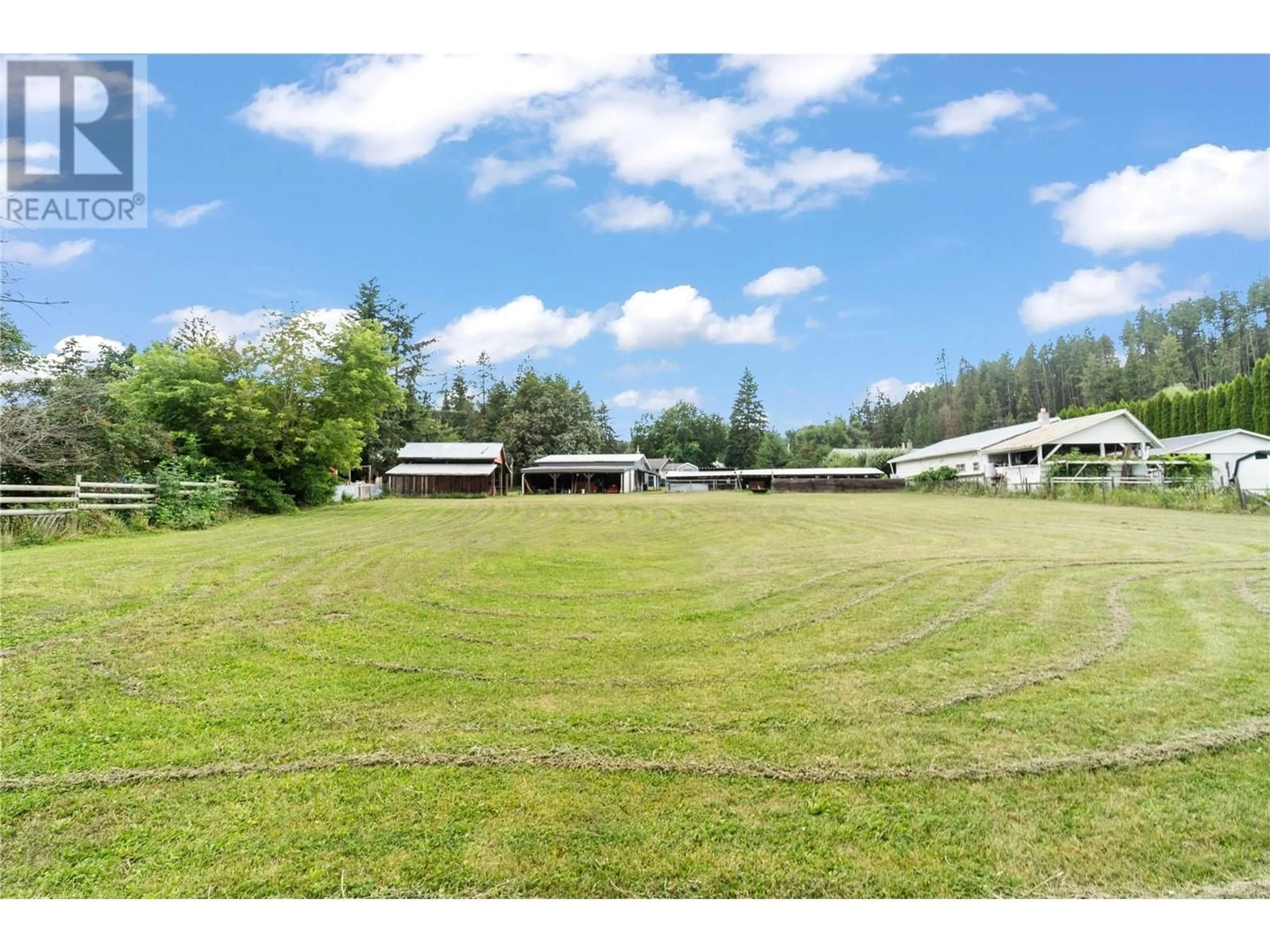 A pic from outside/outdoor area/front of a property/back of a property/a pic from drone, mountain view for 6591 97A HIGHWAY, Enderby British Columbia V0E1V3