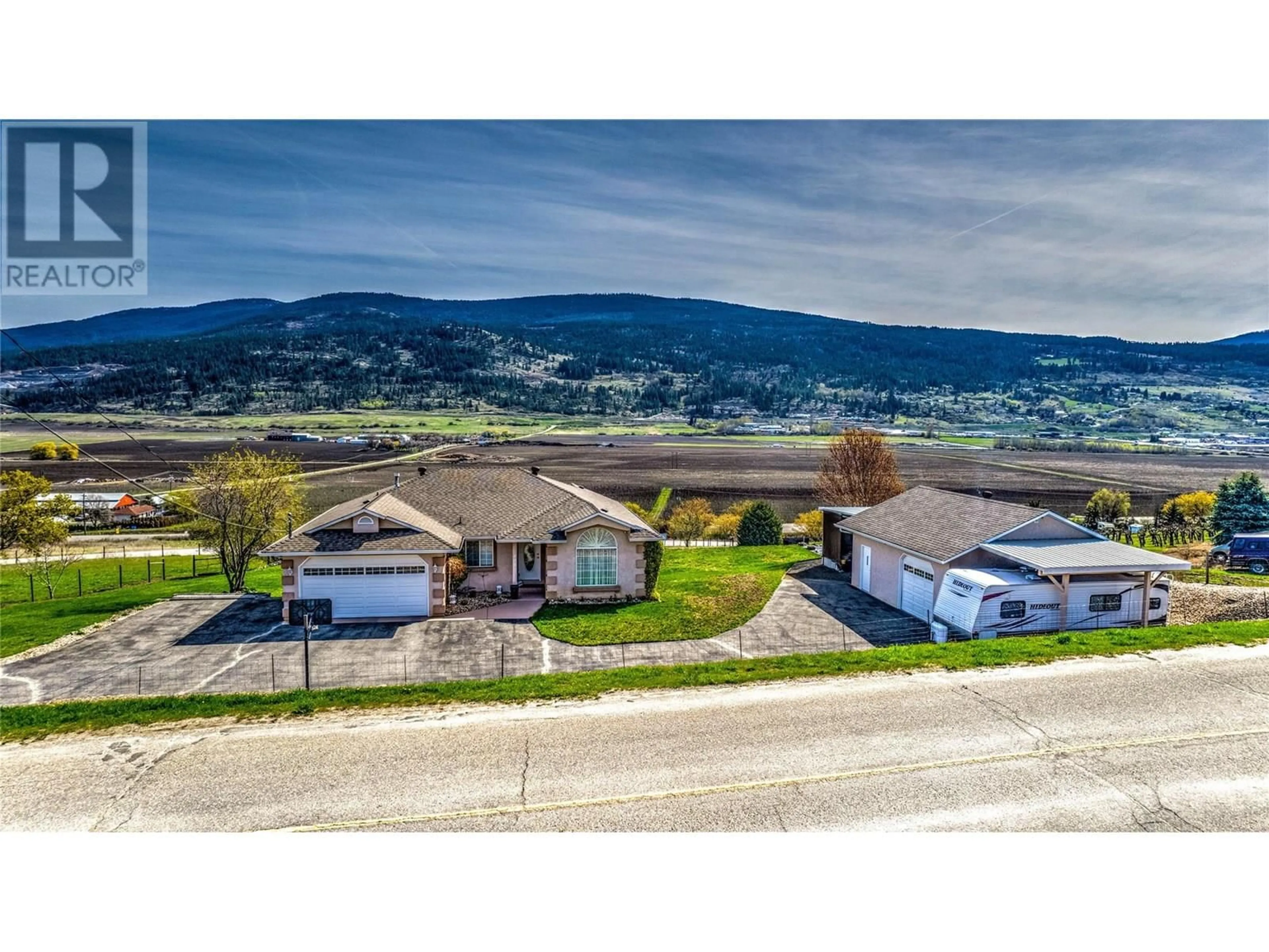 A pic from outside/outdoor area/front of a property/back of a property/a pic from drone, mountain view for 130 OVERLOOK PLACE, Spallumcheen British Columbia V1H1X1