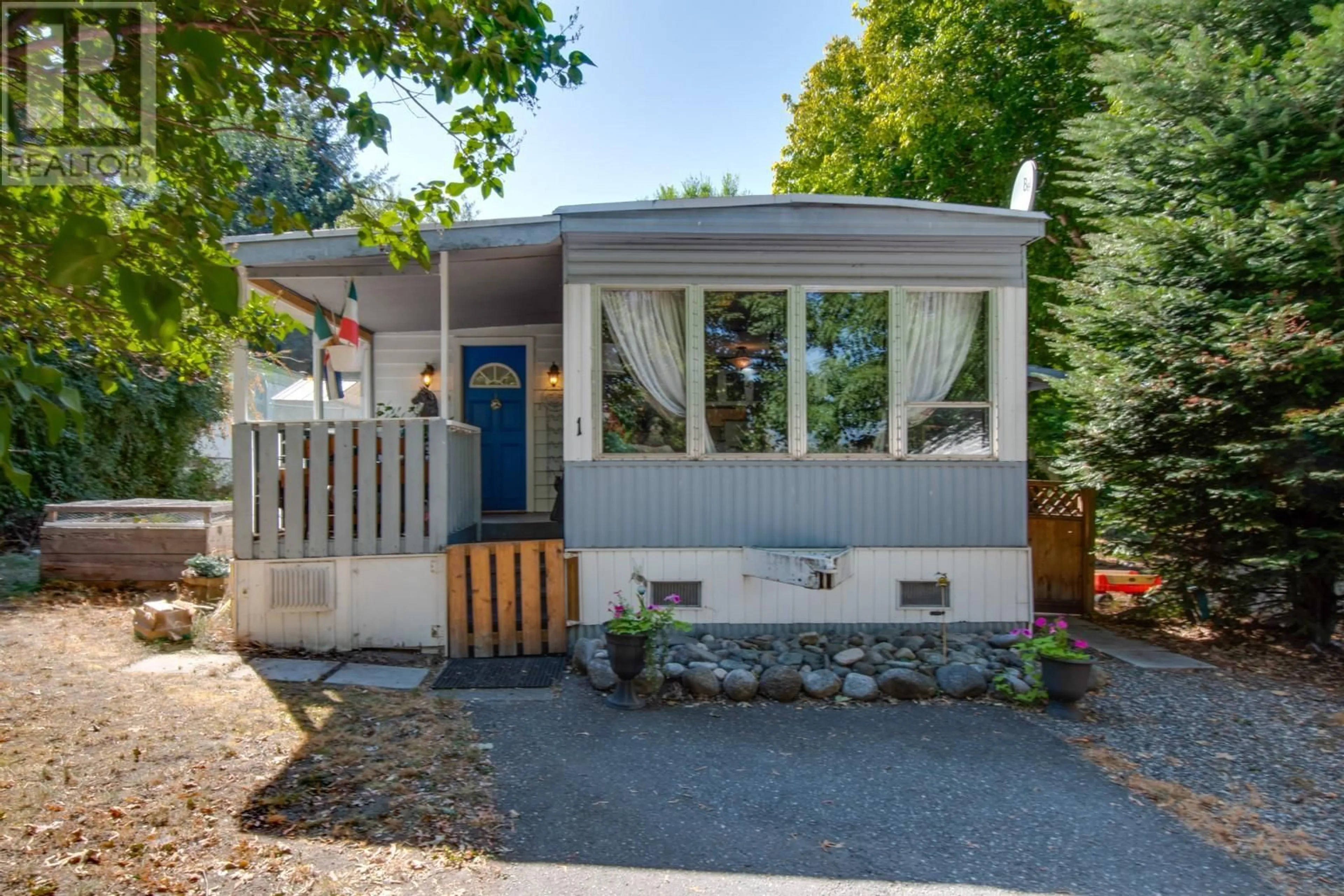 Home with vinyl exterior material, street for 1 - 6080 OKANAGAN AVENUE, Vernon British Columbia V1H1L8