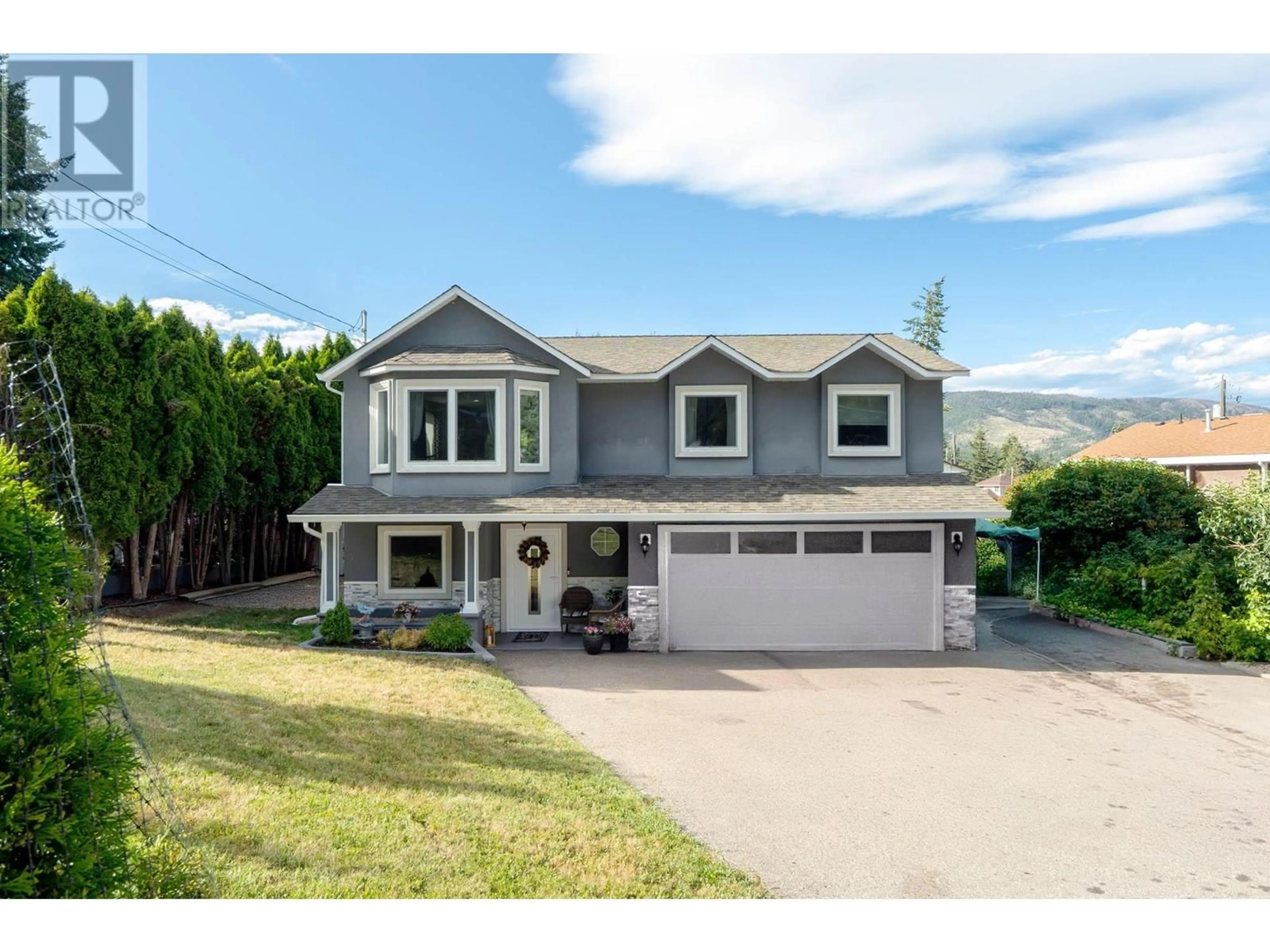 Home with vinyl exterior material, street for 3026 MCIVER ROAD, West Kelowna British Columbia V4T1C6