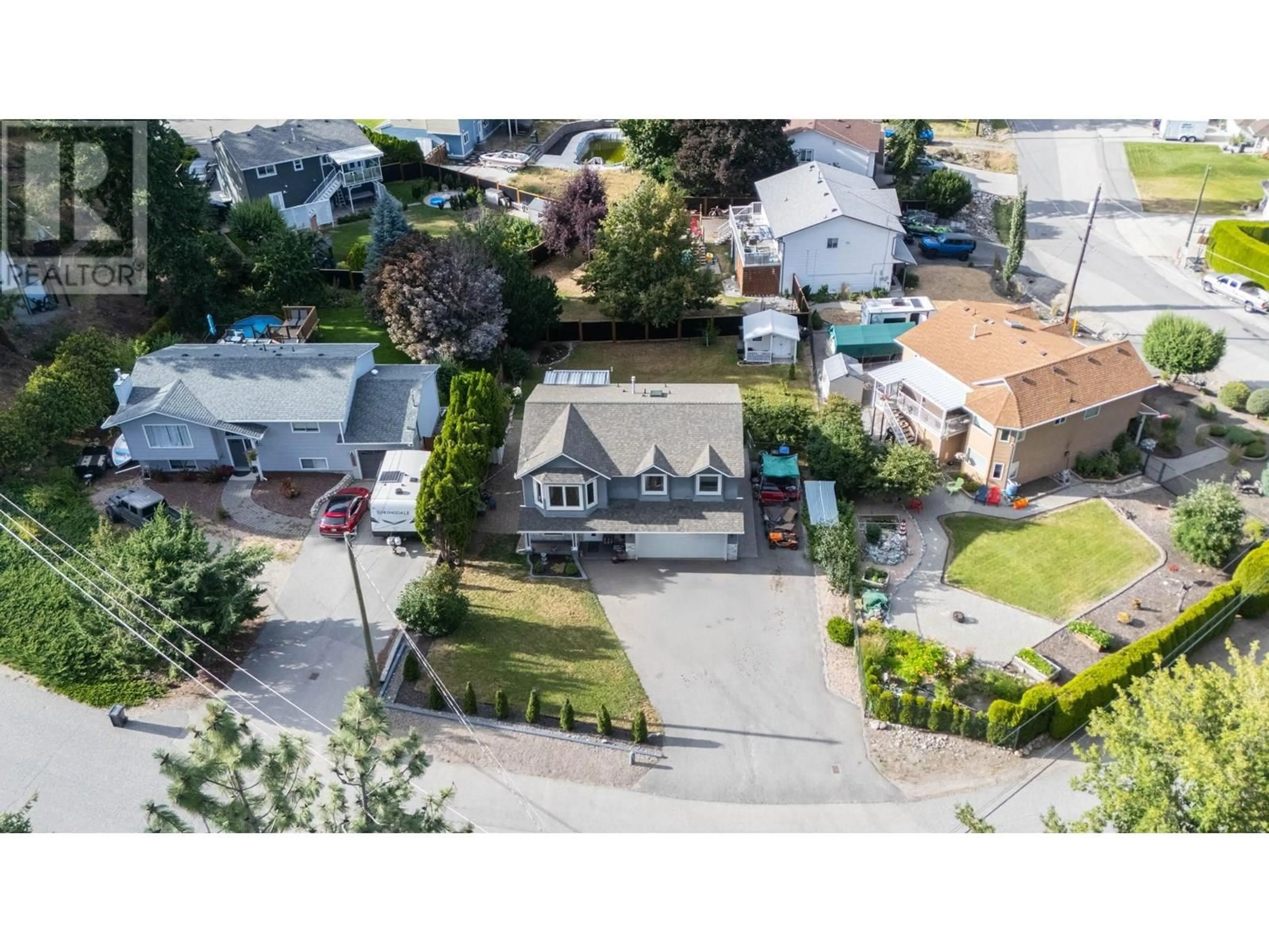A pic from outside/outdoor area/front of a property/back of a property/a pic from drone, street for 3026 MCIVER ROAD, West Kelowna British Columbia V4T1C6