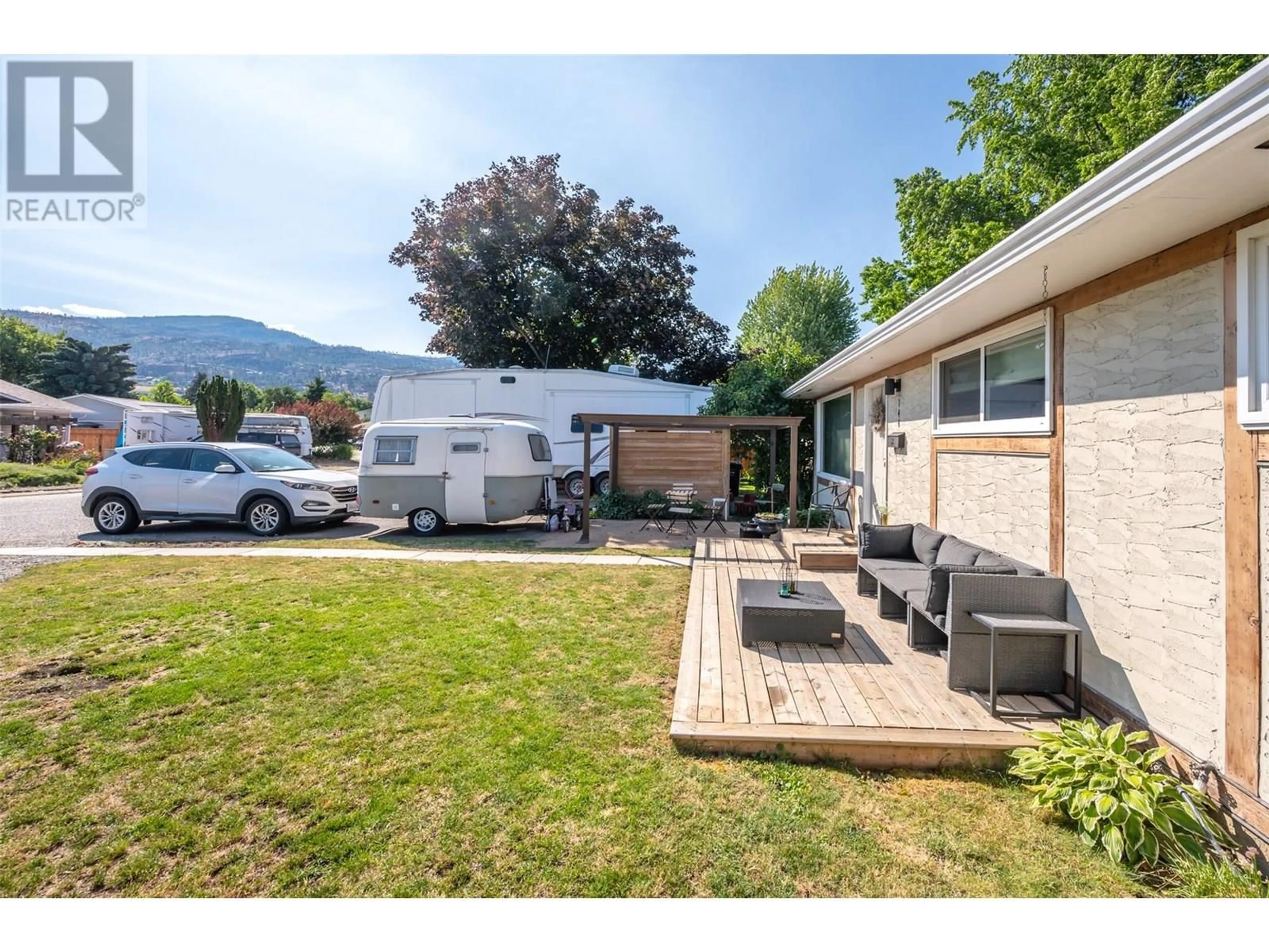 A pic from outside/outdoor area/front of a property/back of a property/a pic from drone, mountain view for 144 AYRES CRESCENT, Penticton British Columbia V2A6R4
