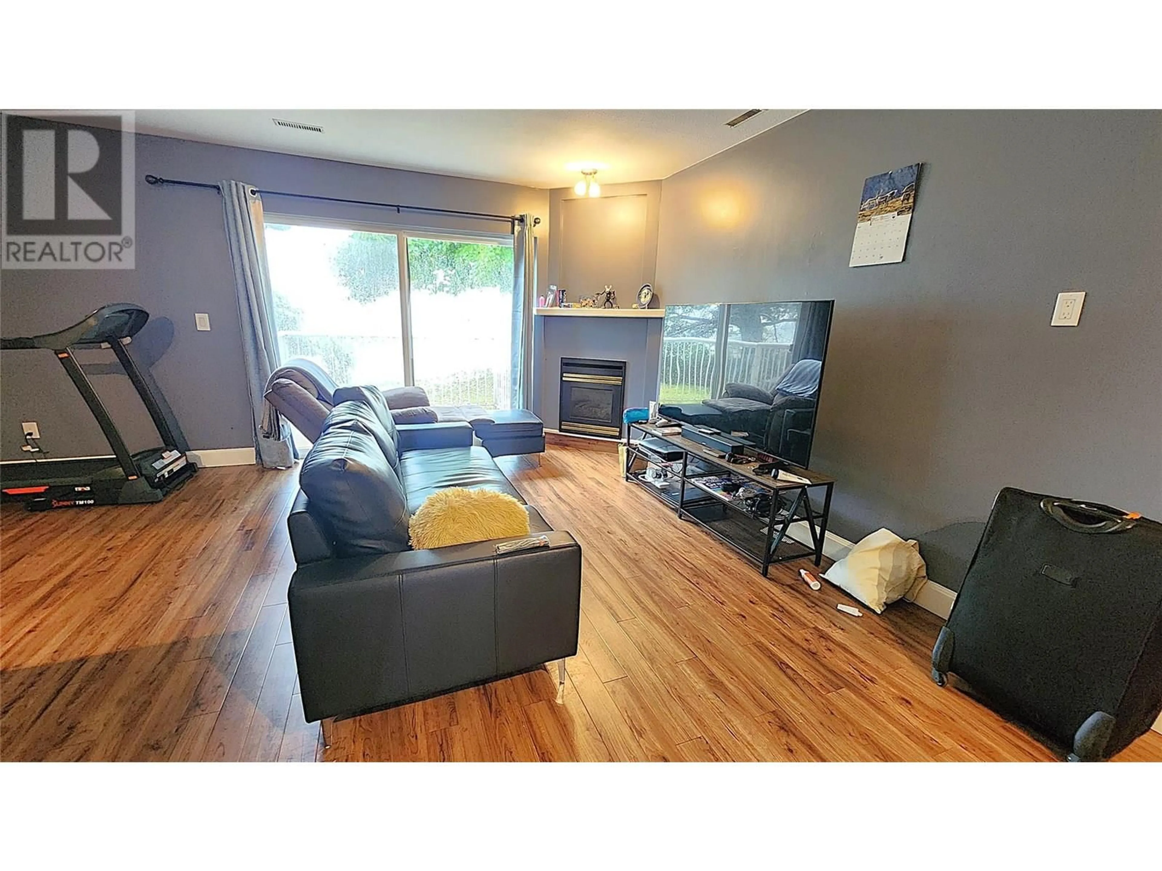 Living room with furniture, wood/laminate floor for 102 - 1990 PACIFIC WAY, Kamloops British Columbia V1S1W3