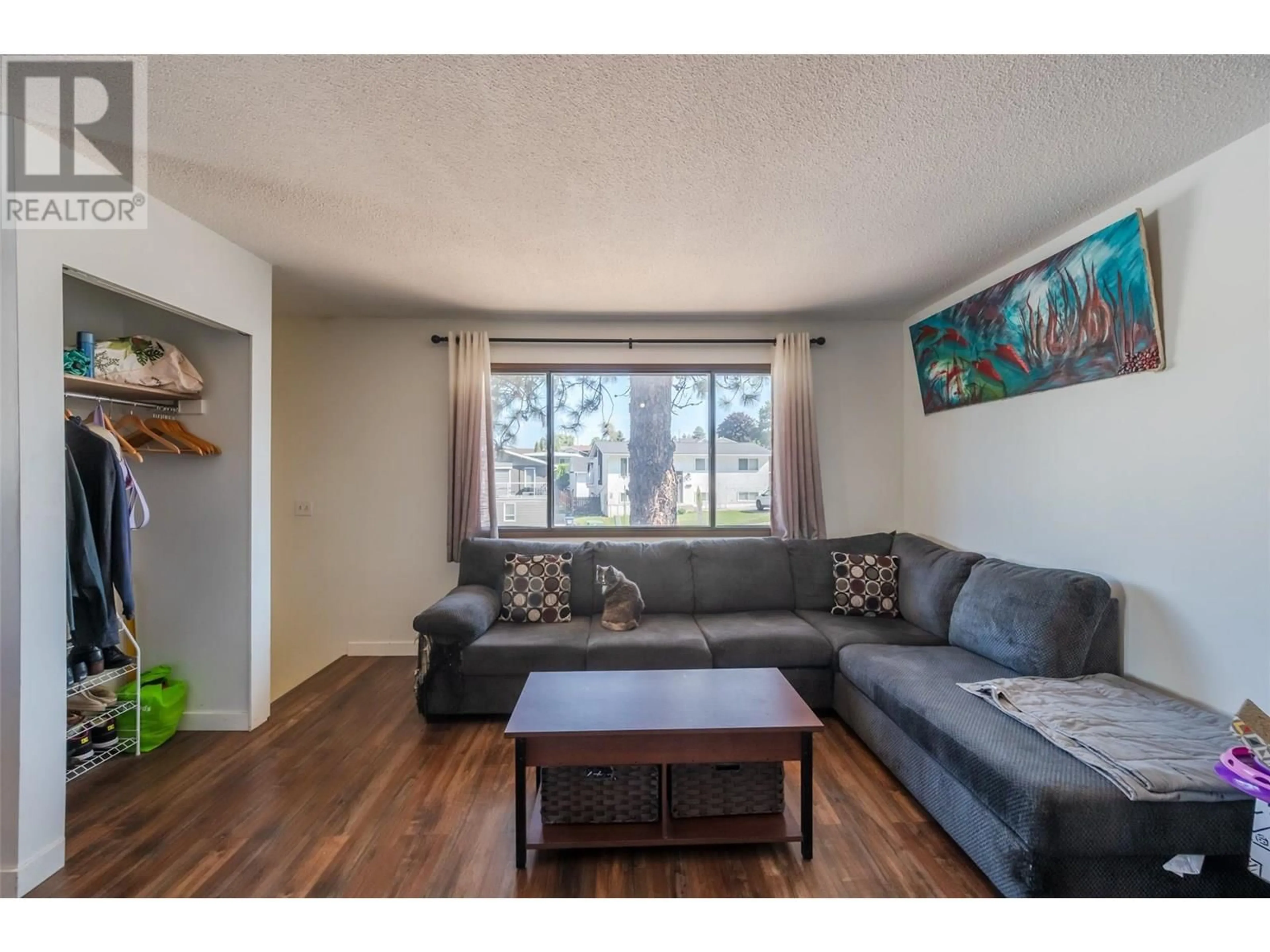 Living room with furniture, wood/laminate floor for 546 BALSAM AVENUE, Penticton British Columbia V2A7v1