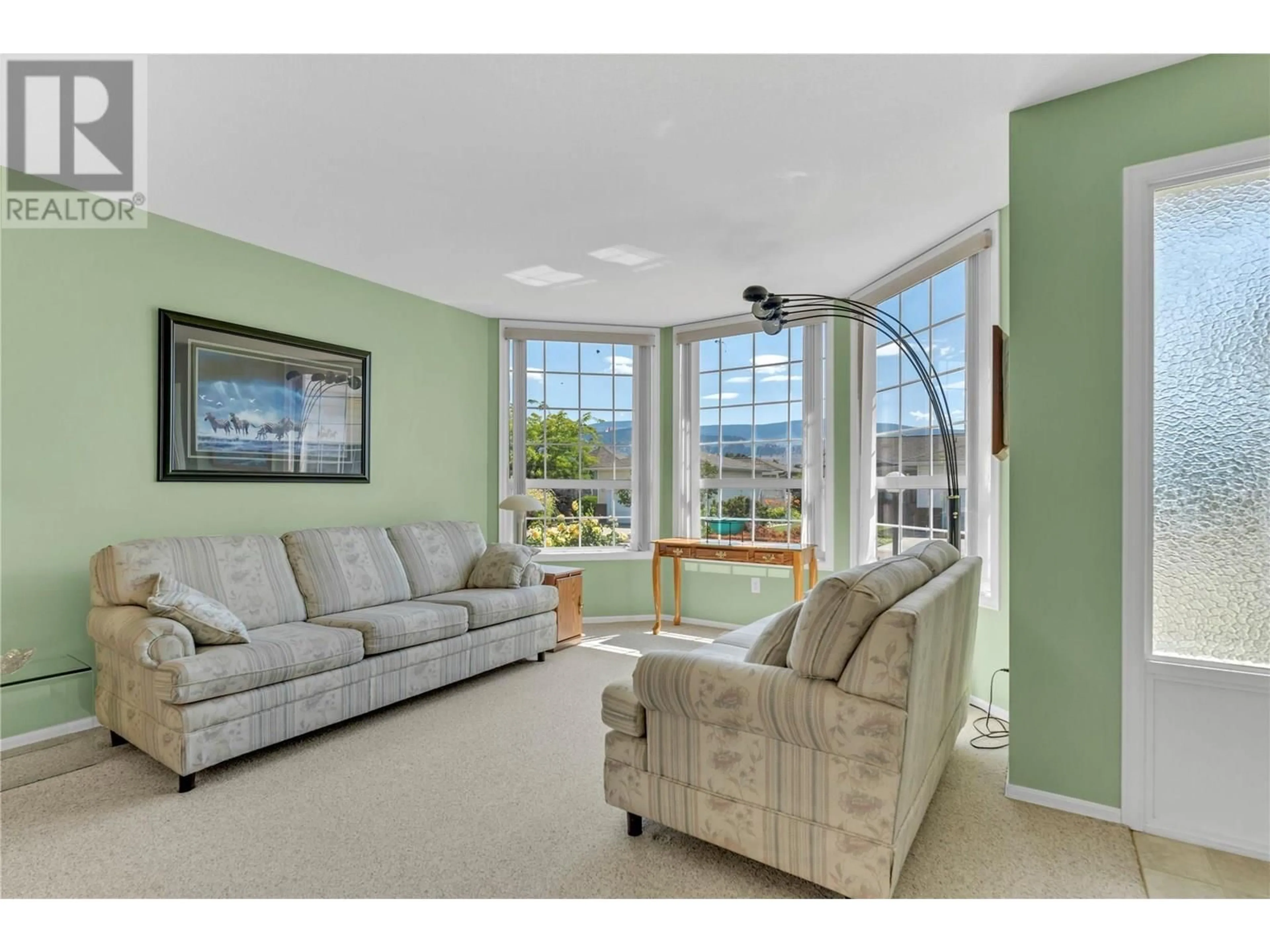 Living room with furniture, ceramic/tile floor for 210 SANDPIPER CRESCENT, Penticton British Columbia V2A8K6