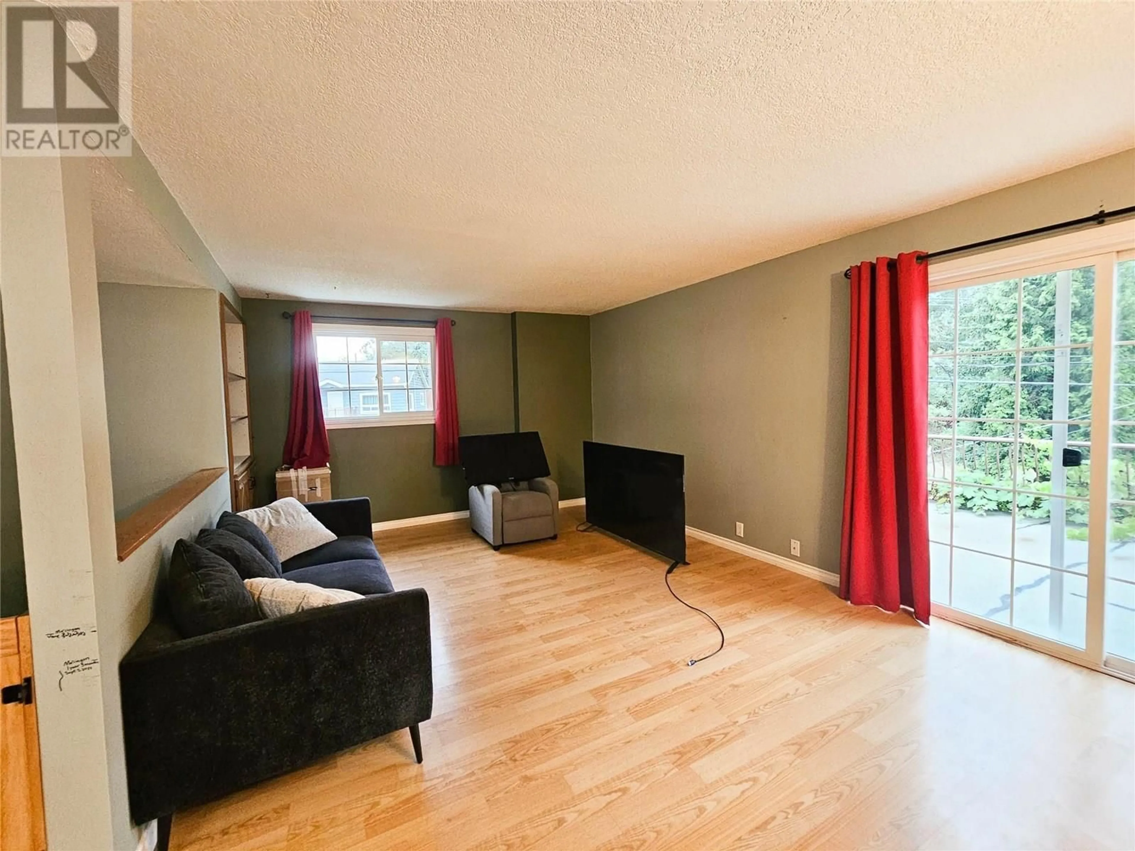 Living room with furniture, wood/laminate floor for 2296 EIGHTH AVENUE, Trail British Columbia V1R3E3