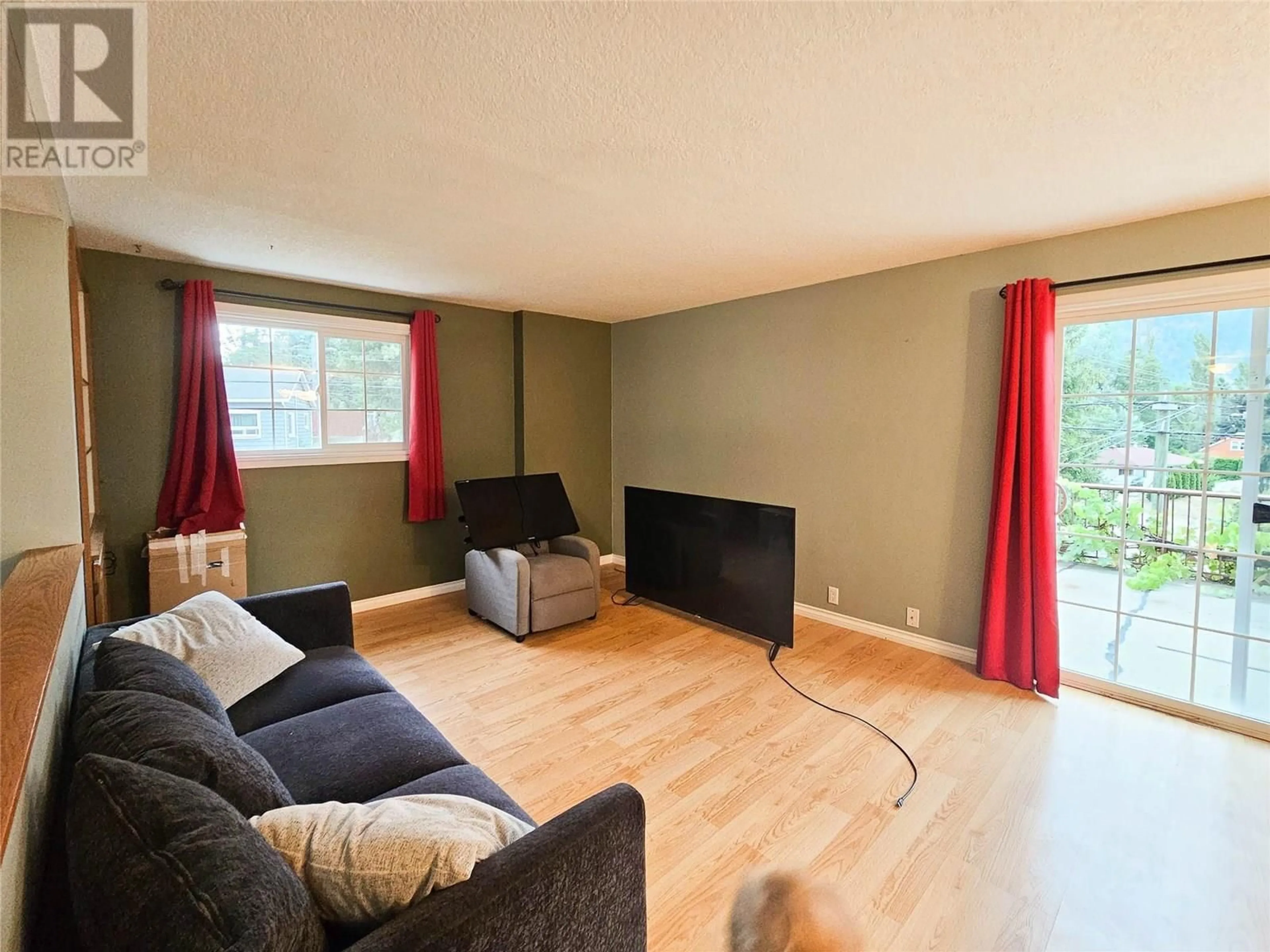 Living room with furniture, wood/laminate floor for 2296 EIGHTH AVENUE, Trail British Columbia V1R3E3