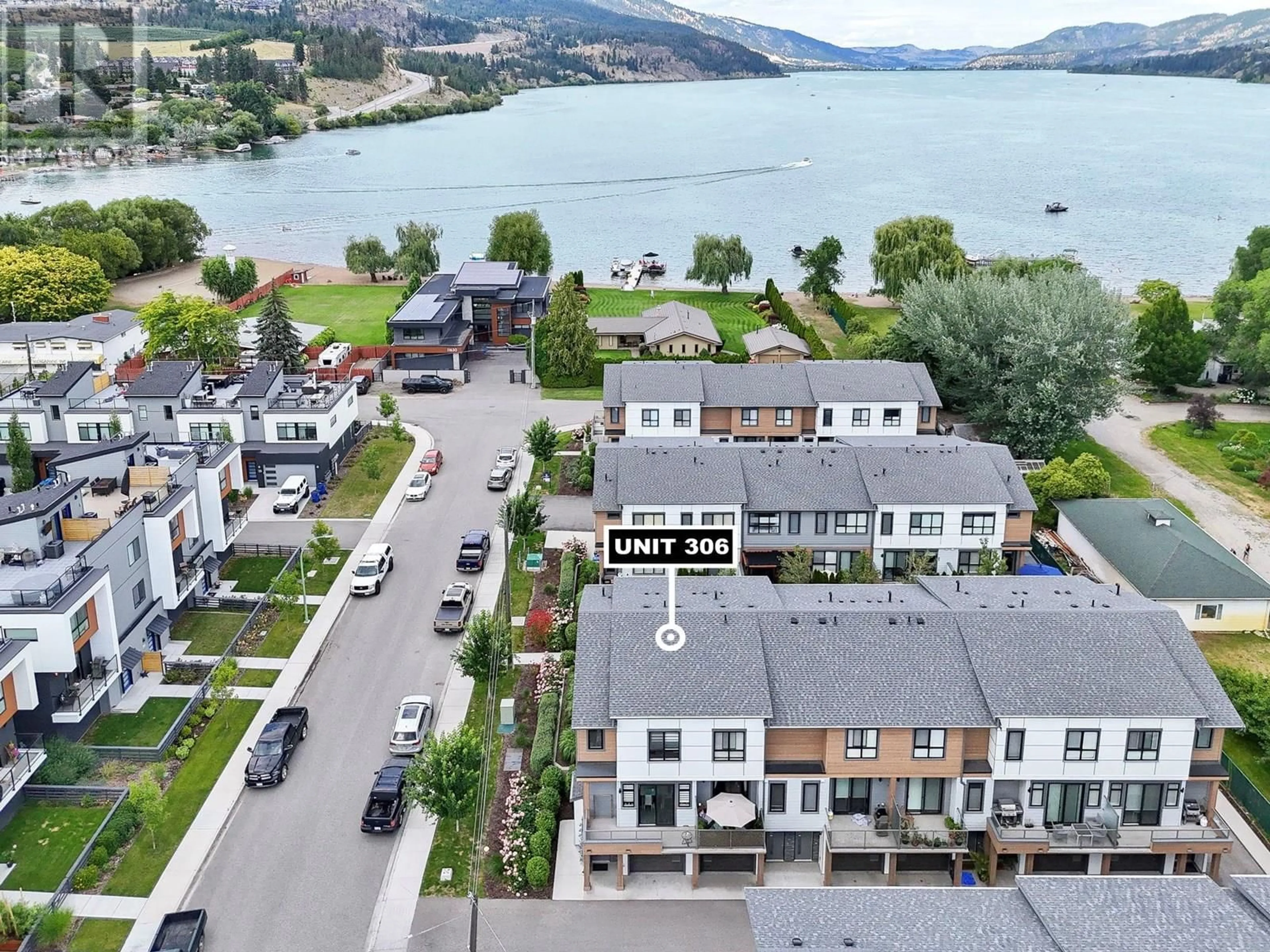 A pic from outside/outdoor area/front of a property/back of a property/a pic from drone, water/lake/river/ocean view for 306 - 11581 ROGERS ROAD, Lake Country British Columbia V4V1X8