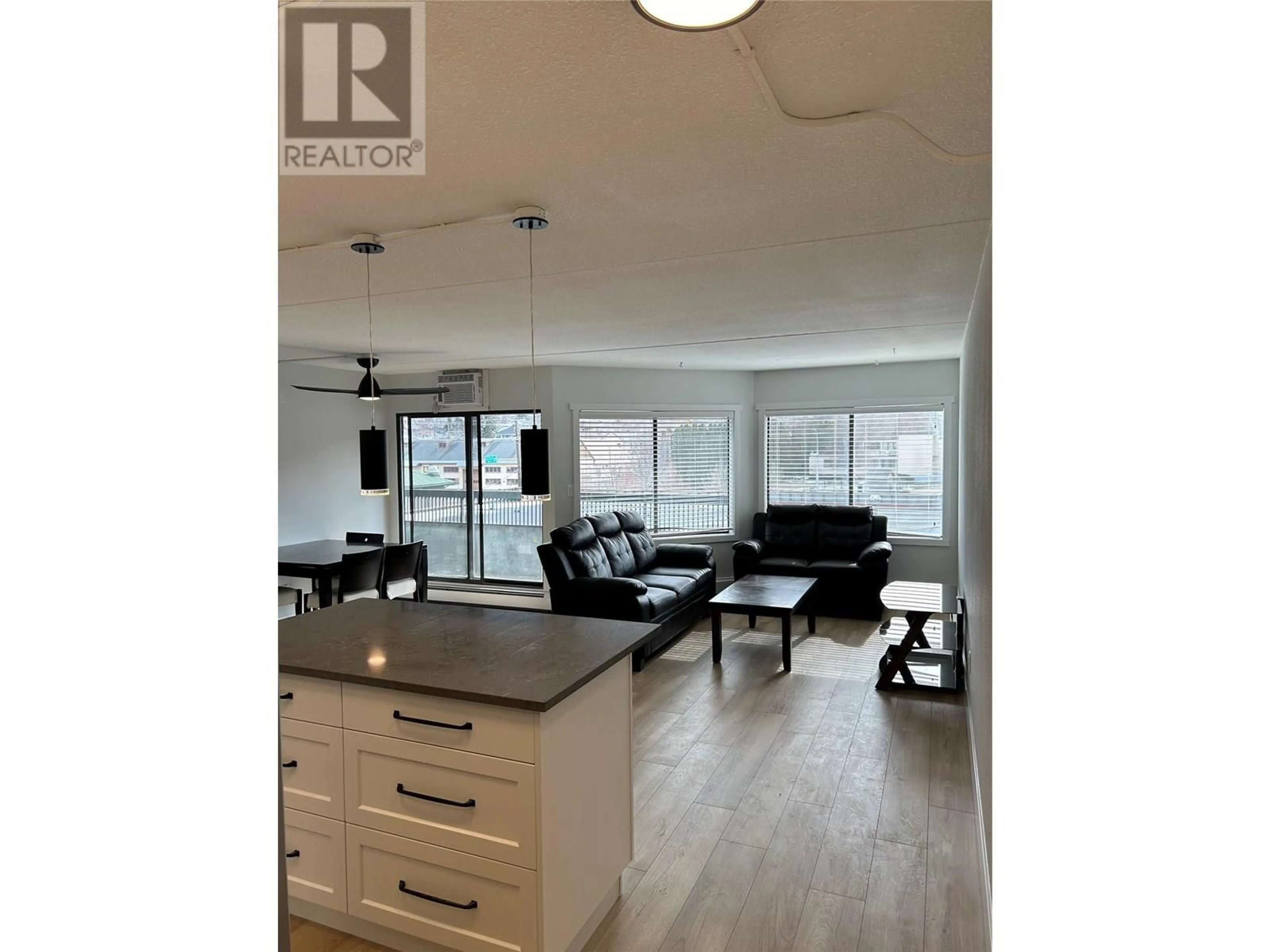 Open concept kitchen, wood/laminate floor for 403 - 525 NICOLA STREET, Kamloops British Columbia V2C6J5