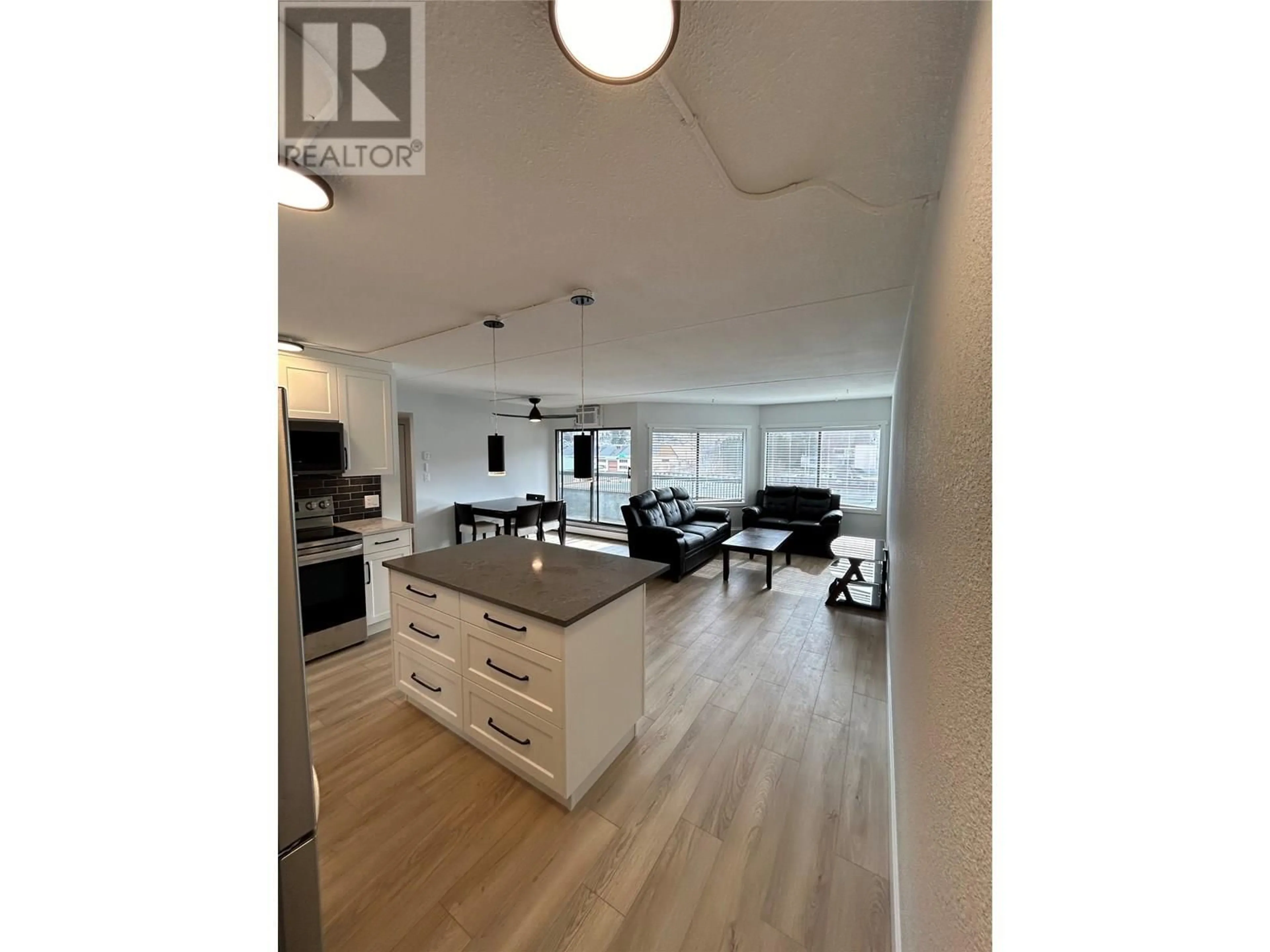 Open concept kitchen, wood/laminate floor for 403 - 525 NICOLA STREET, Kamloops British Columbia V2C6J5