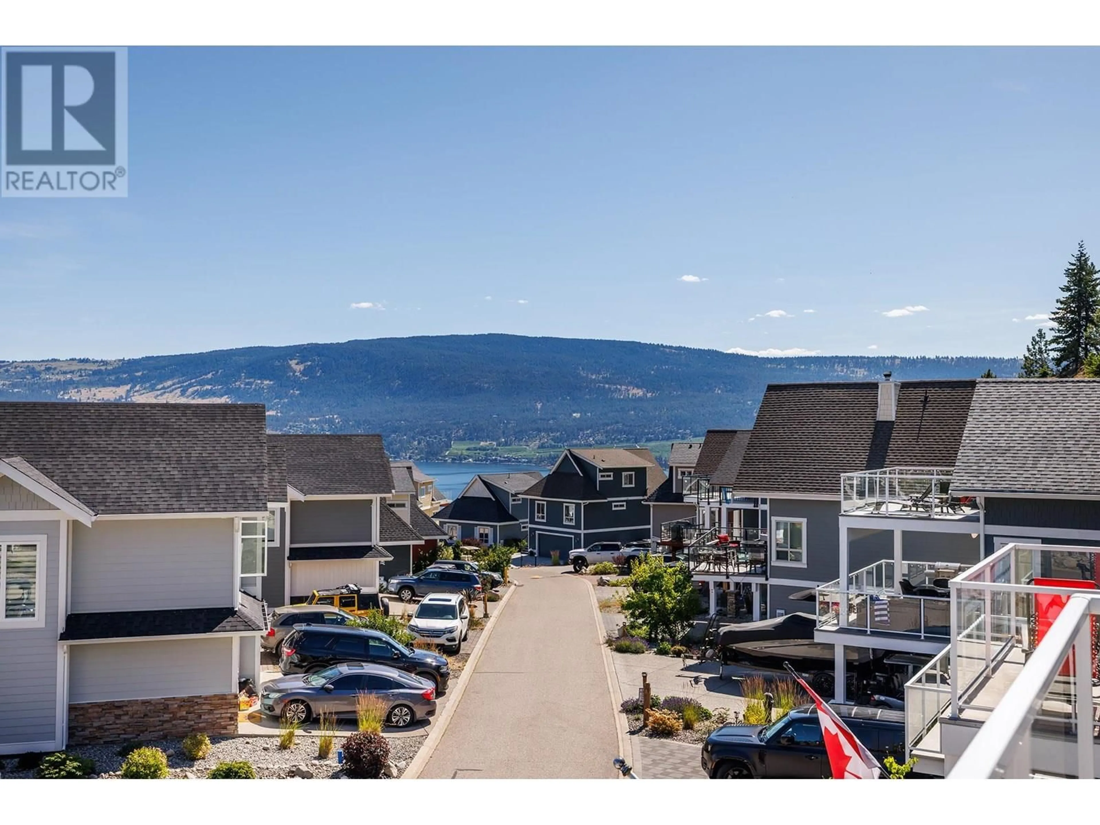 A pic from outside/outdoor area/front of a property/back of a property/a pic from drone, mountain view for 6746 MARBELLA LOOP, Kelowna British Columbia V1Z3R8