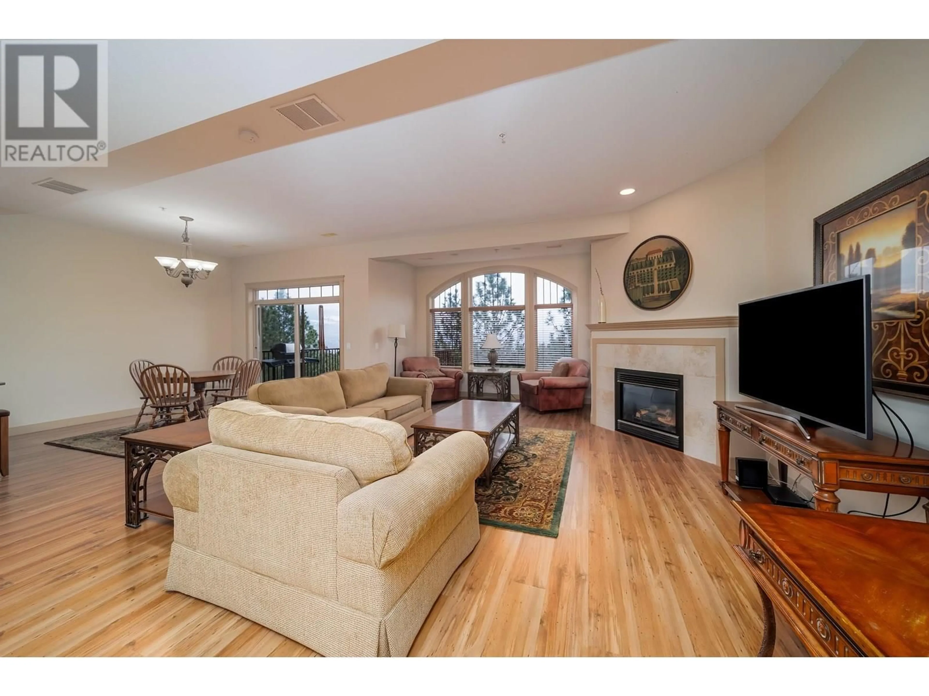 Living room with furniture, wood/laminate floor for 229 - 1795 COUNTRY CLUB DRIVE, Kelowna British Columbia V1V2V9