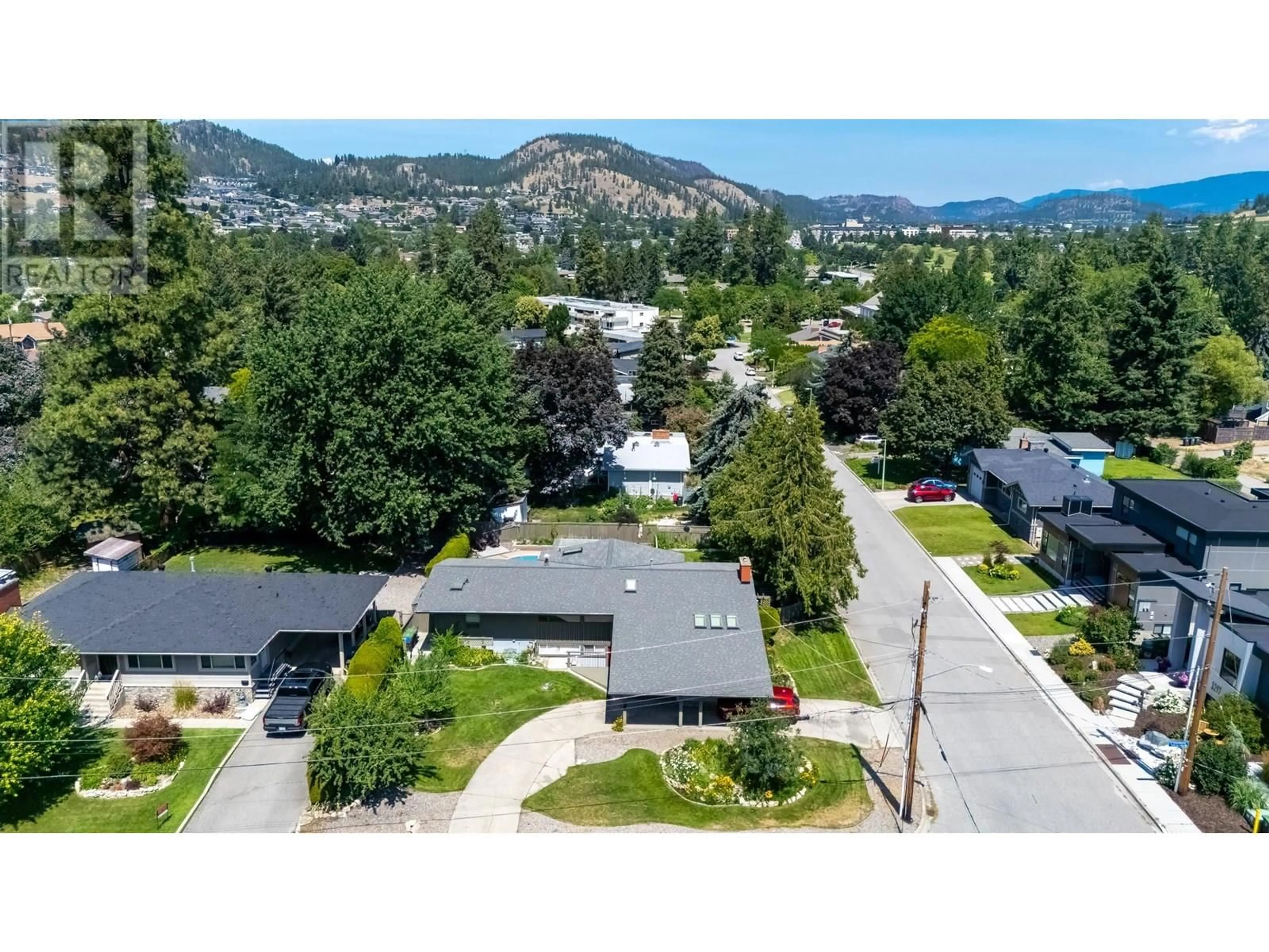 A pic from outside/outdoor area/front of a property/back of a property/a pic from drone, mountain view for 1798 GLENELLA PLACE, Kelowna British Columbia V1Y4M8