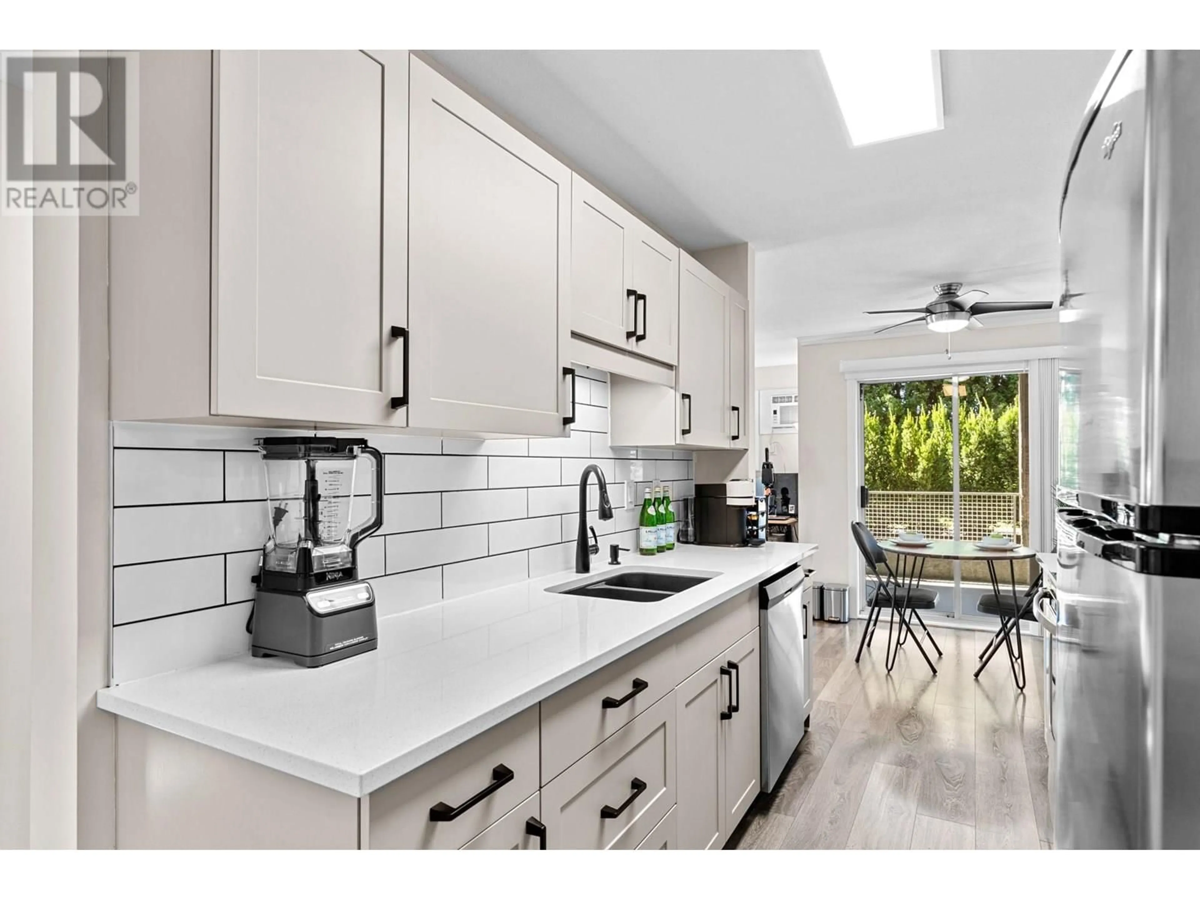 Open concept kitchen, ceramic/tile floor for 102 - 2035 BARON ROAD, Kelowna British Columbia V1X7G3