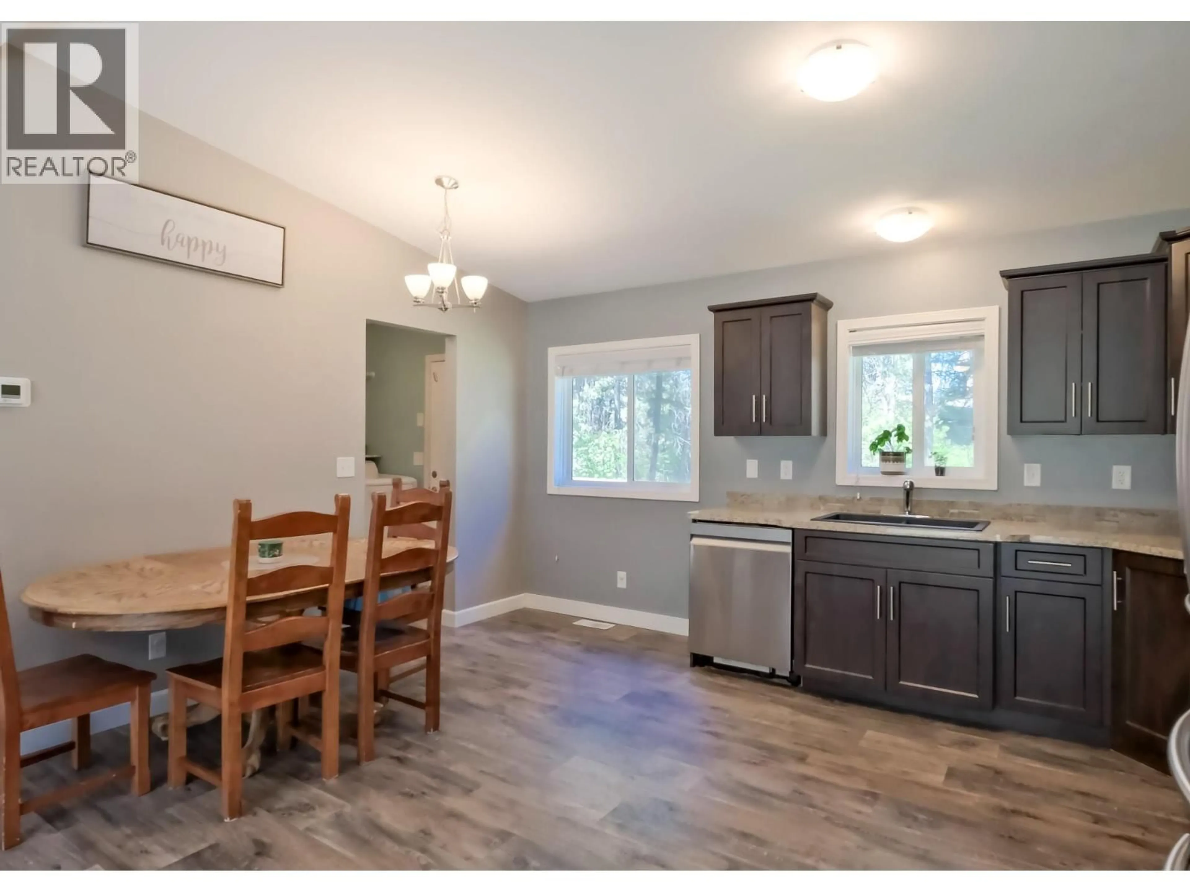 Open concept kitchen, wood/laminate floor for 7867 ALPINE ROAD, Kelowna British Columbia V1Z3V4