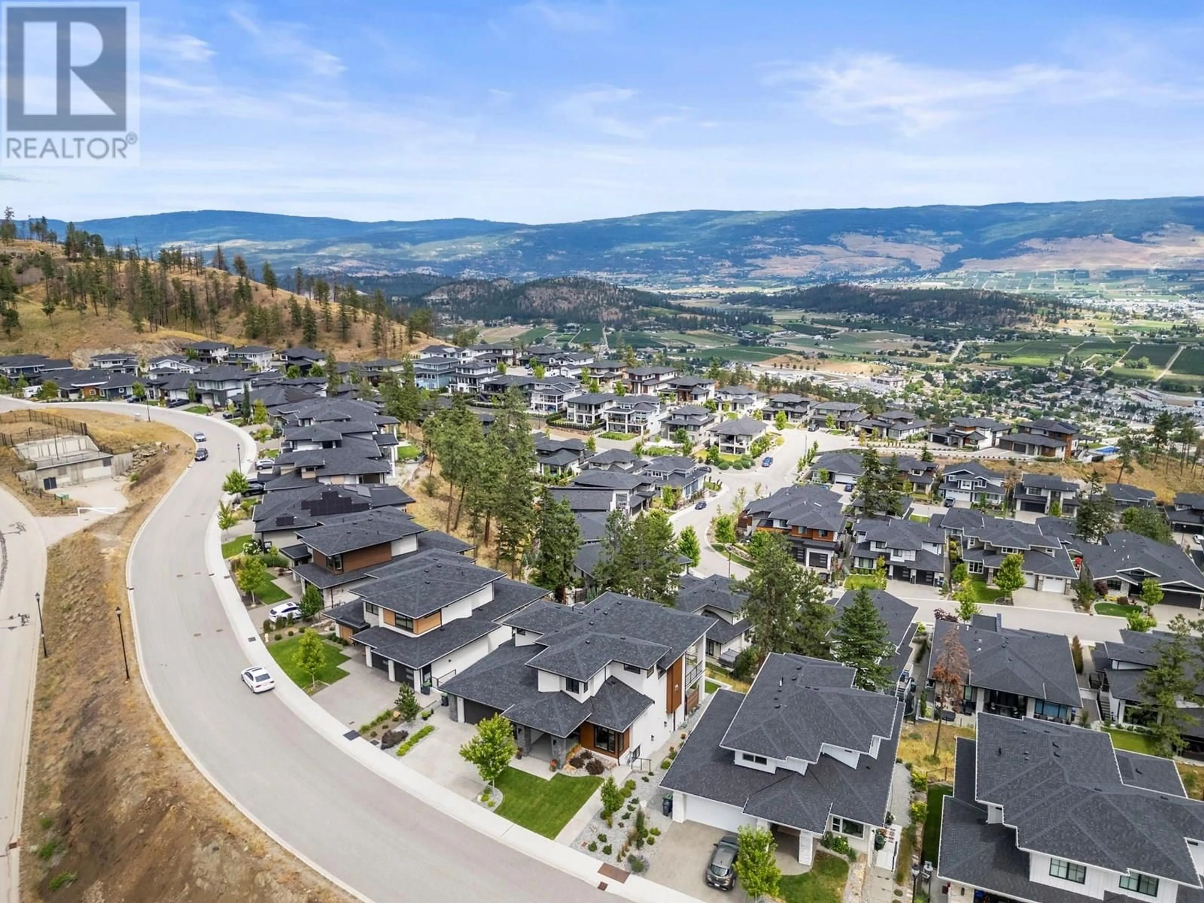 A pic from outside/outdoor area/front of a property/back of a property/a pic from drone, mountain view for 145 SUMMER WOOD DRIVE, Kelowna British Columbia V1V0C9