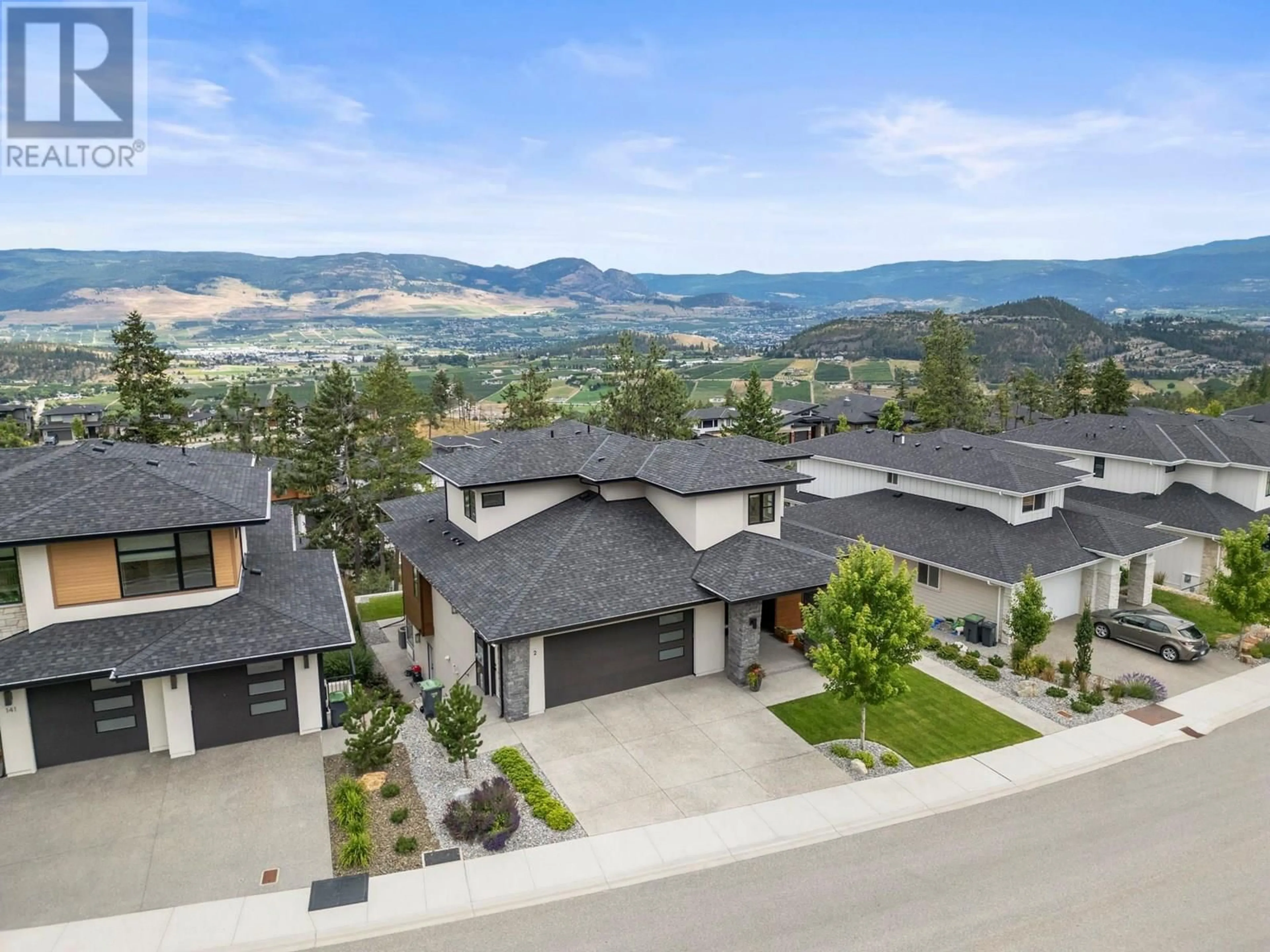 A pic from outside/outdoor area/front of a property/back of a property/a pic from drone, mountain view for 145 SUMMER WOOD DRIVE, Kelowna British Columbia V1V0C9