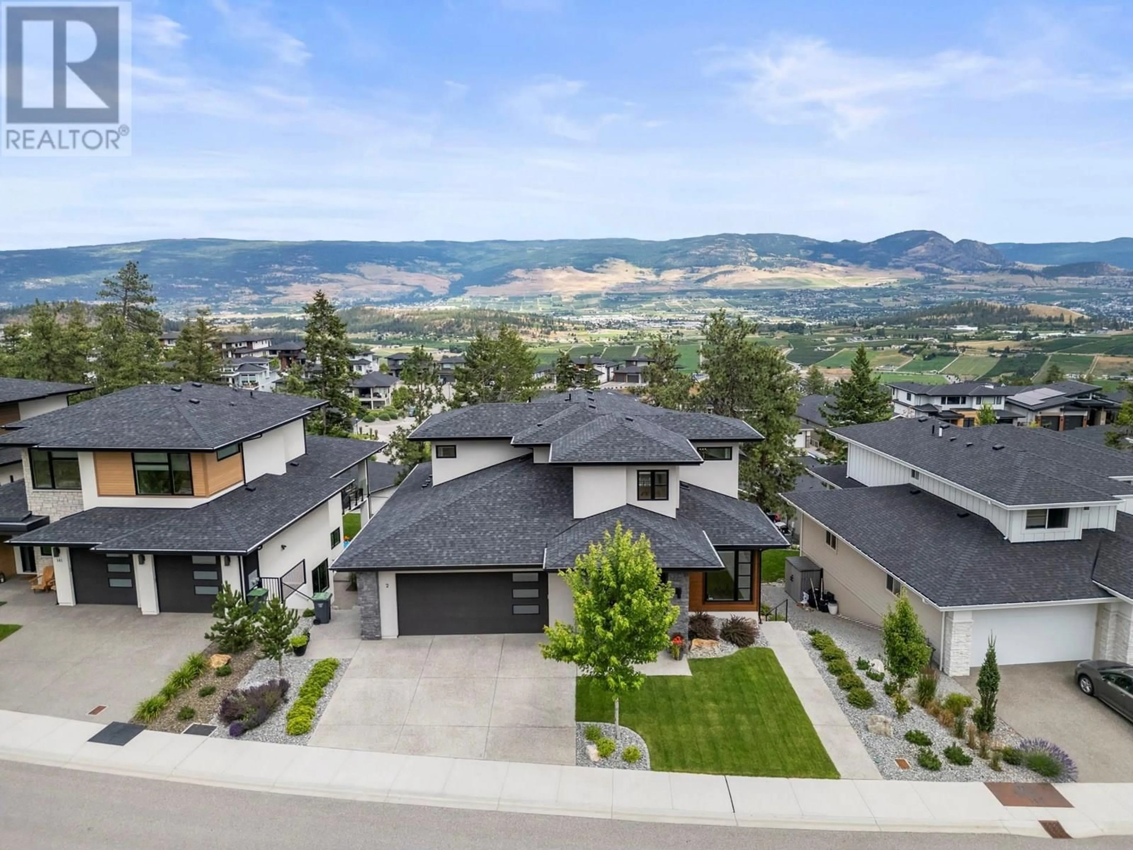 A pic from outside/outdoor area/front of a property/back of a property/a pic from drone, mountain view for 145 SUMMER WOOD DRIVE, Kelowna British Columbia V1V0C9