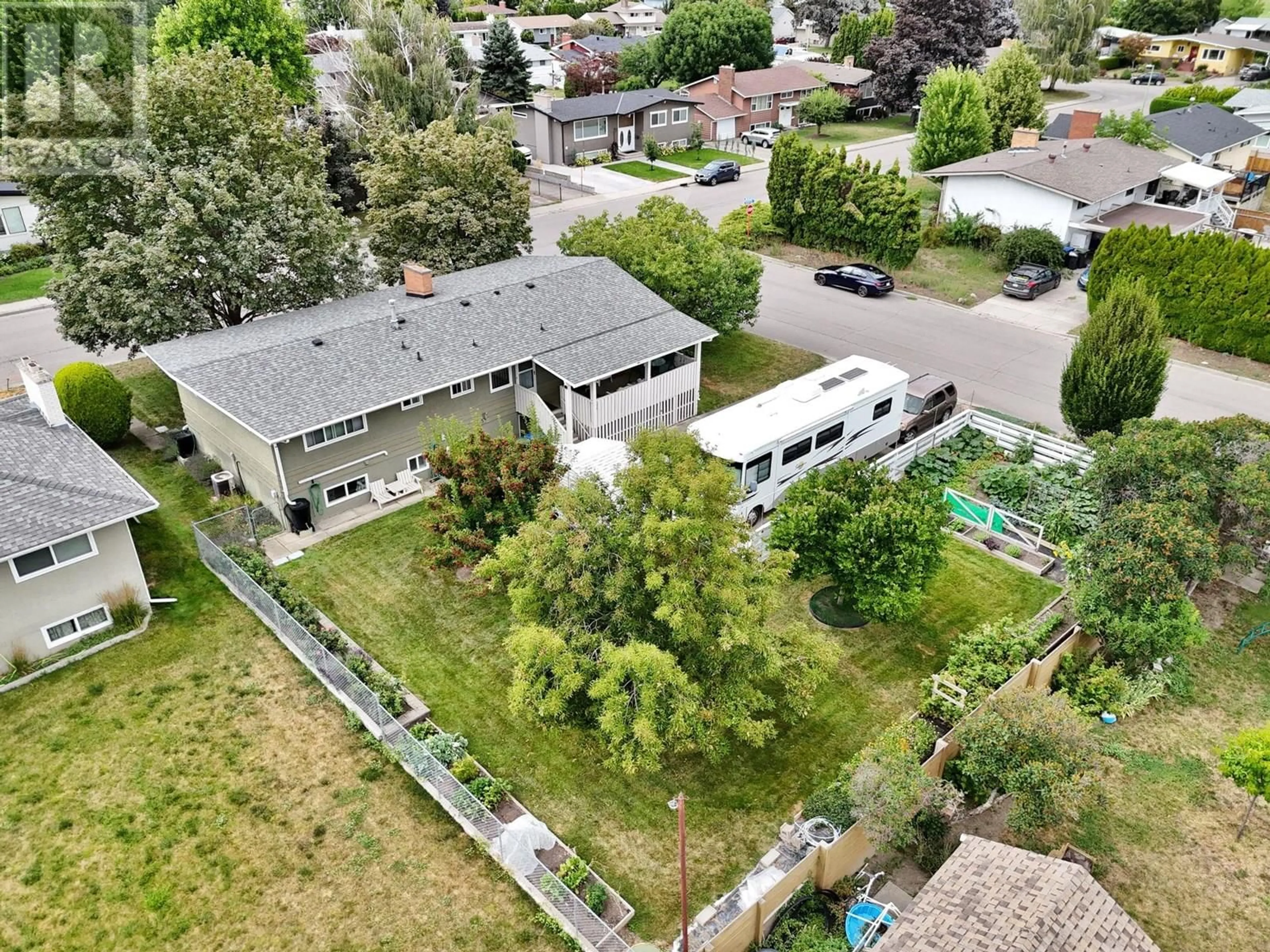 A pic from outside/outdoor area/front of a property/back of a property/a pic from drone, street for 1498 LOMBARDY SQUARE, Kelowna British Columbia V1Y3S7