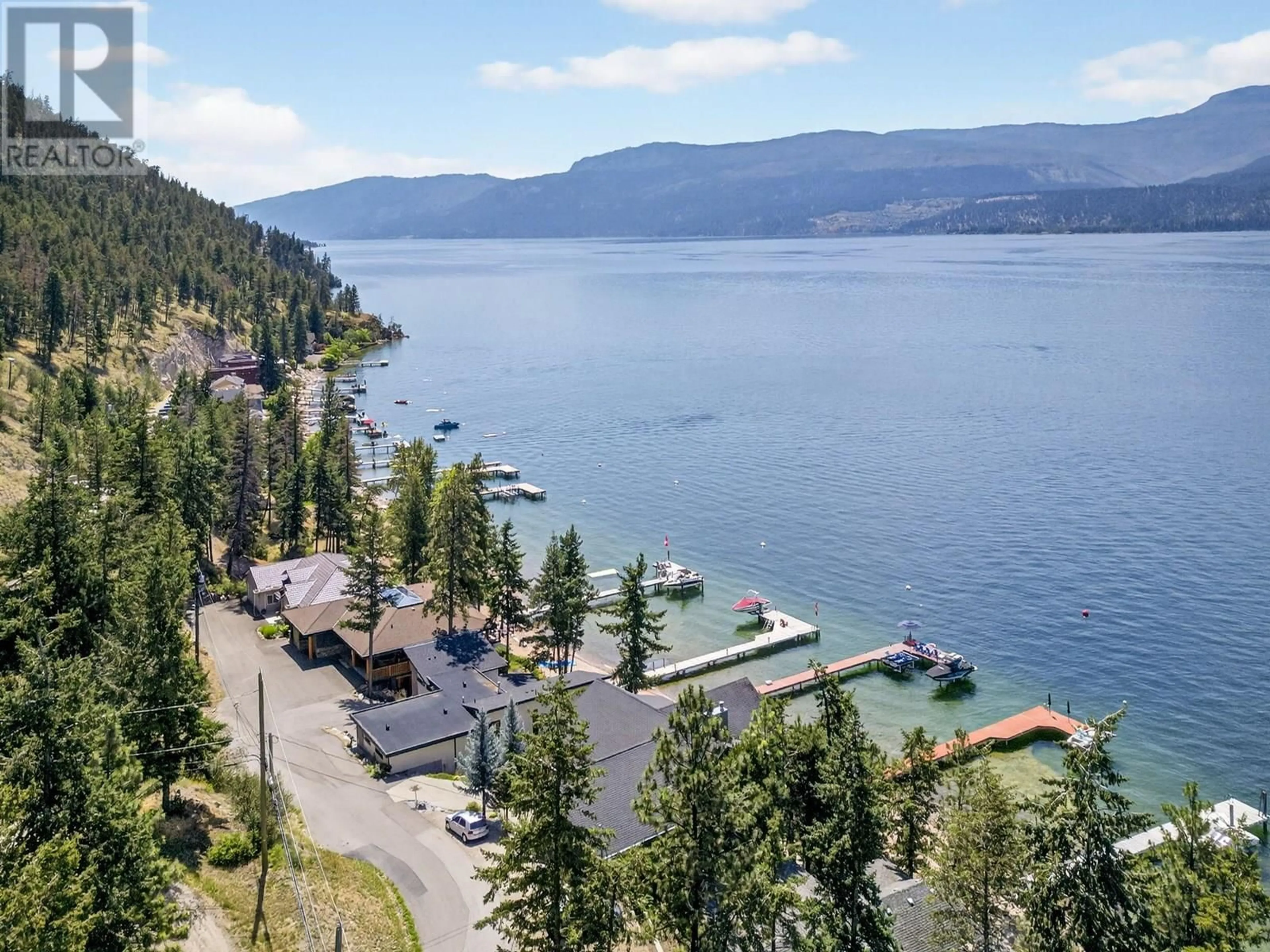 A pic from outside/outdoor area/front of a property/back of a property/a pic from drone, water/lake/river/ocean view for 20 - 9900 EASTSIDE ROAD, Vernon British Columbia V1H1L6