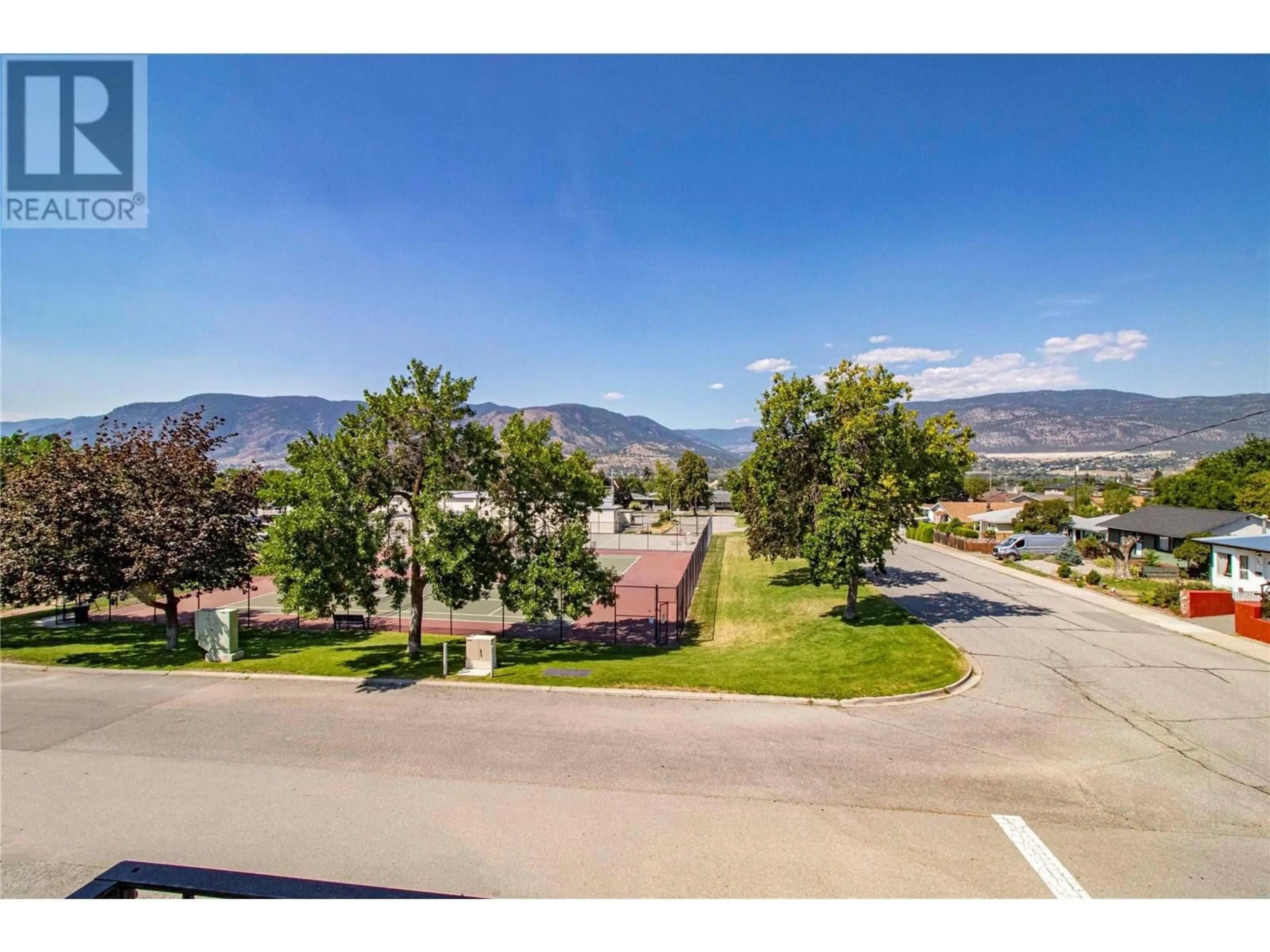 A pic from outside/outdoor area/front of a property/back of a property/a pic from drone, mountain view for 301 - 1300 CHURCH STREET, Penticton British Columbia V2A4R8
