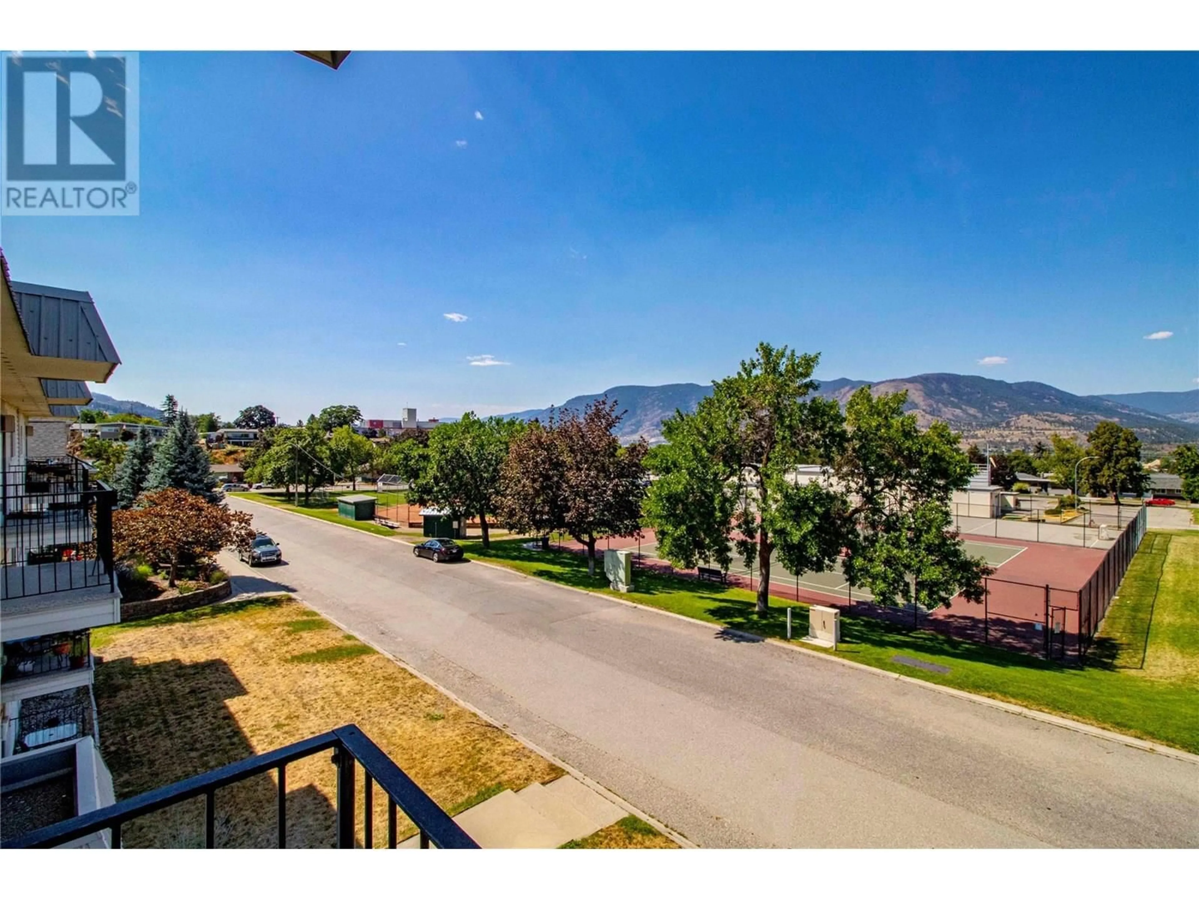 A pic from outside/outdoor area/front of a property/back of a property/a pic from drone, mountain view for 301 - 1300 CHURCH STREET, Penticton British Columbia V2A4R8