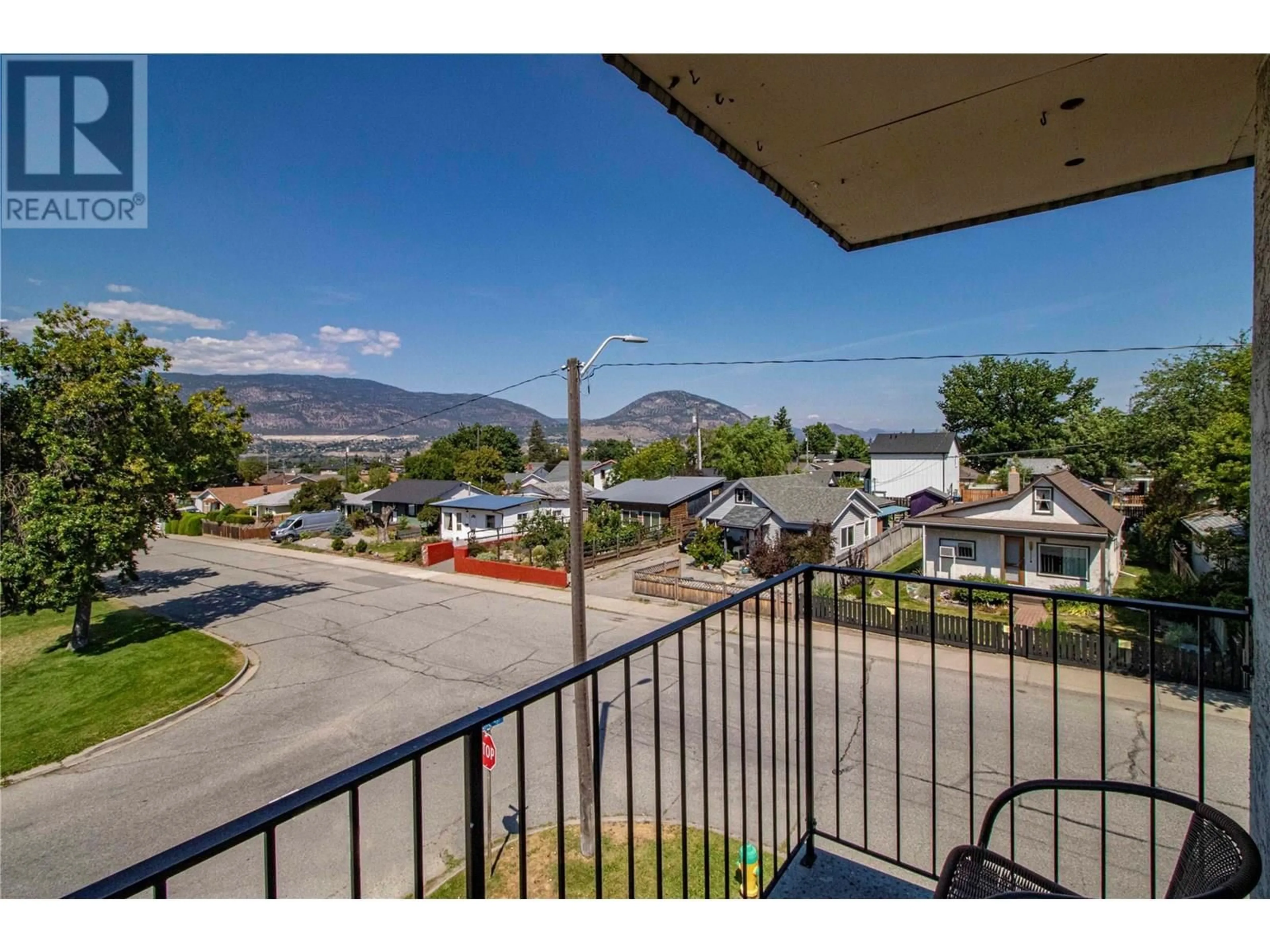 A pic from outside/outdoor area/front of a property/back of a property/a pic from drone, mountain view for 301 - 1300 CHURCH STREET, Penticton British Columbia V2A4R8