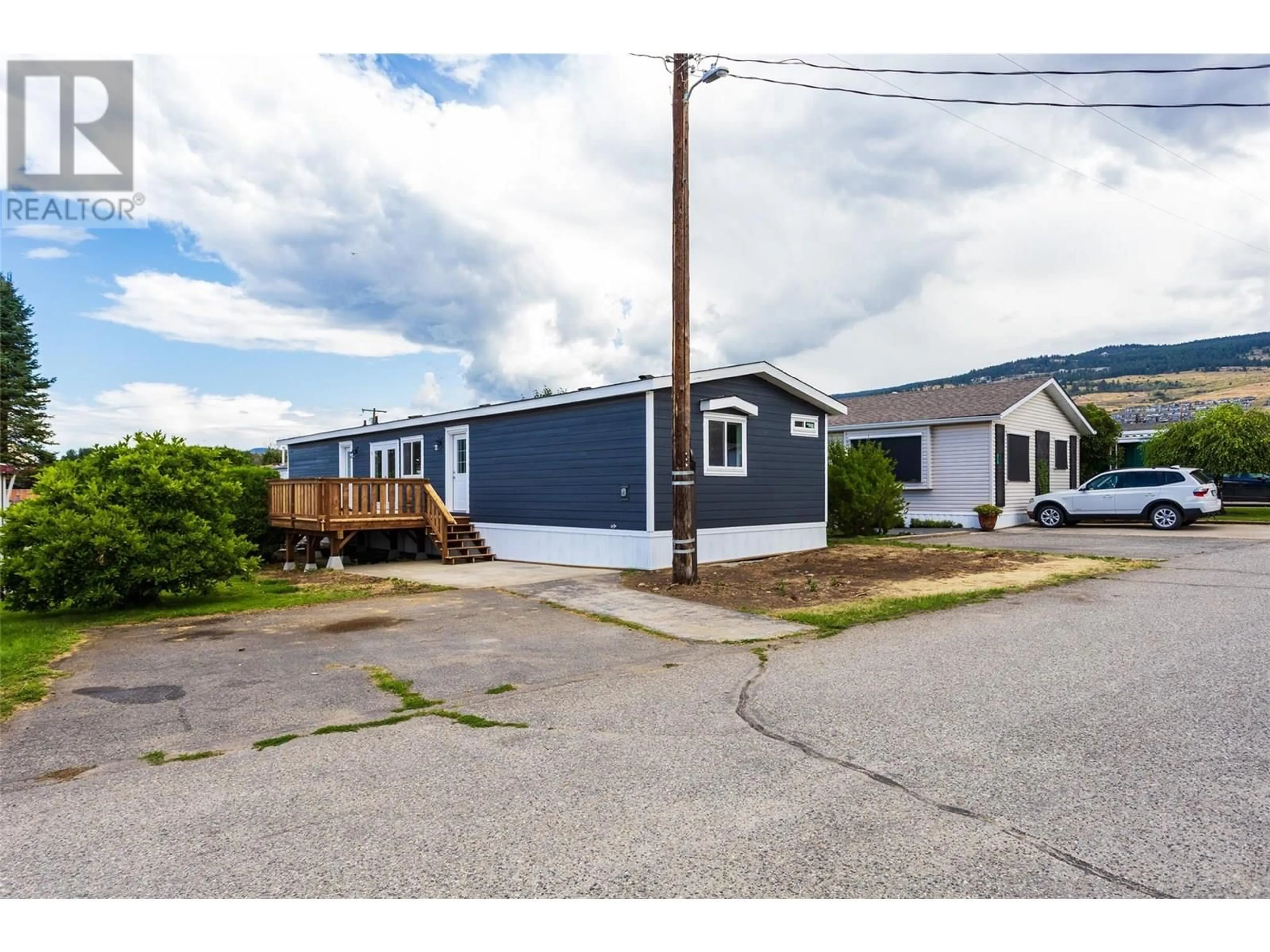 A pic from outside/outdoor area/front of a property/back of a property/a pic from drone, street for 312 - 3591 OLD VERNON ROAD, Kelowna British Columbia V1X6P4