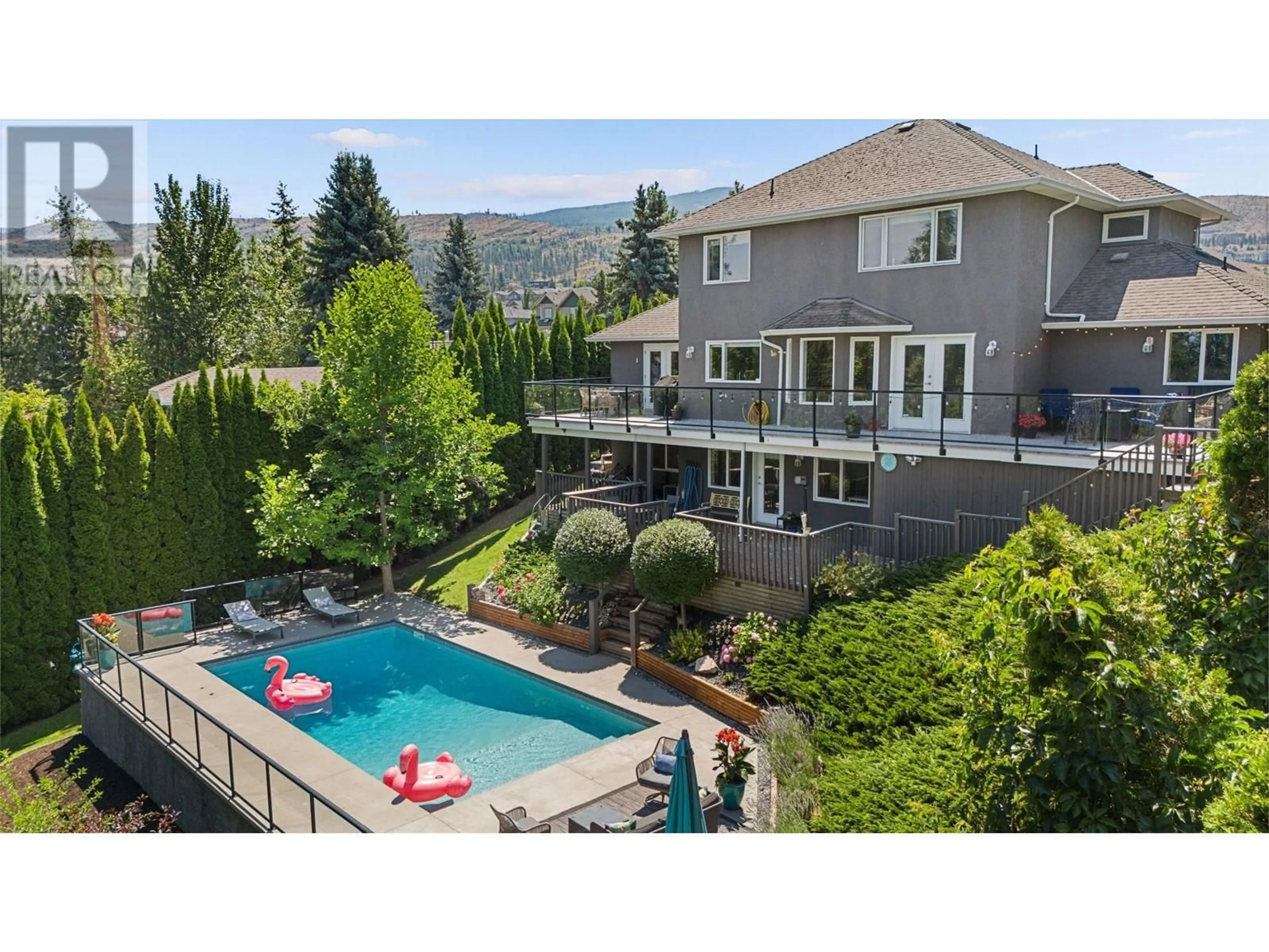 A pic from outside/outdoor area/front of a property/back of a property/a pic from drone, mountain view for 409 CURLEW DRIVE, Kelowna British Columbia V1W4L3