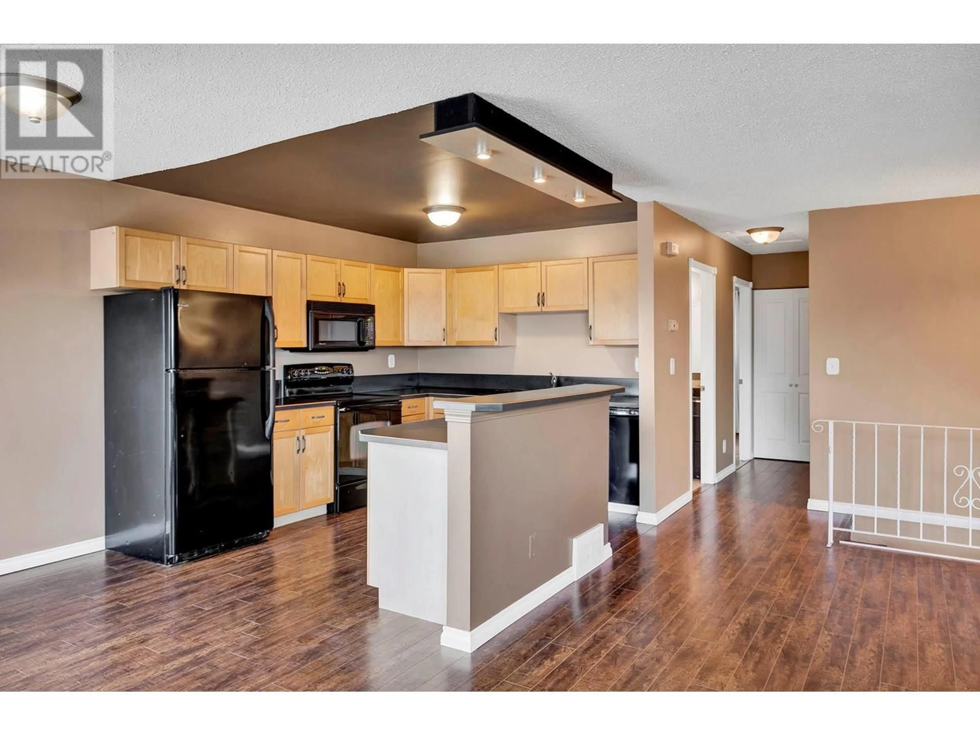 Open concept kitchen, wood/laminate floor for 315 WADDINGTON DRIVE, Kamloops British Columbia V2E1S3