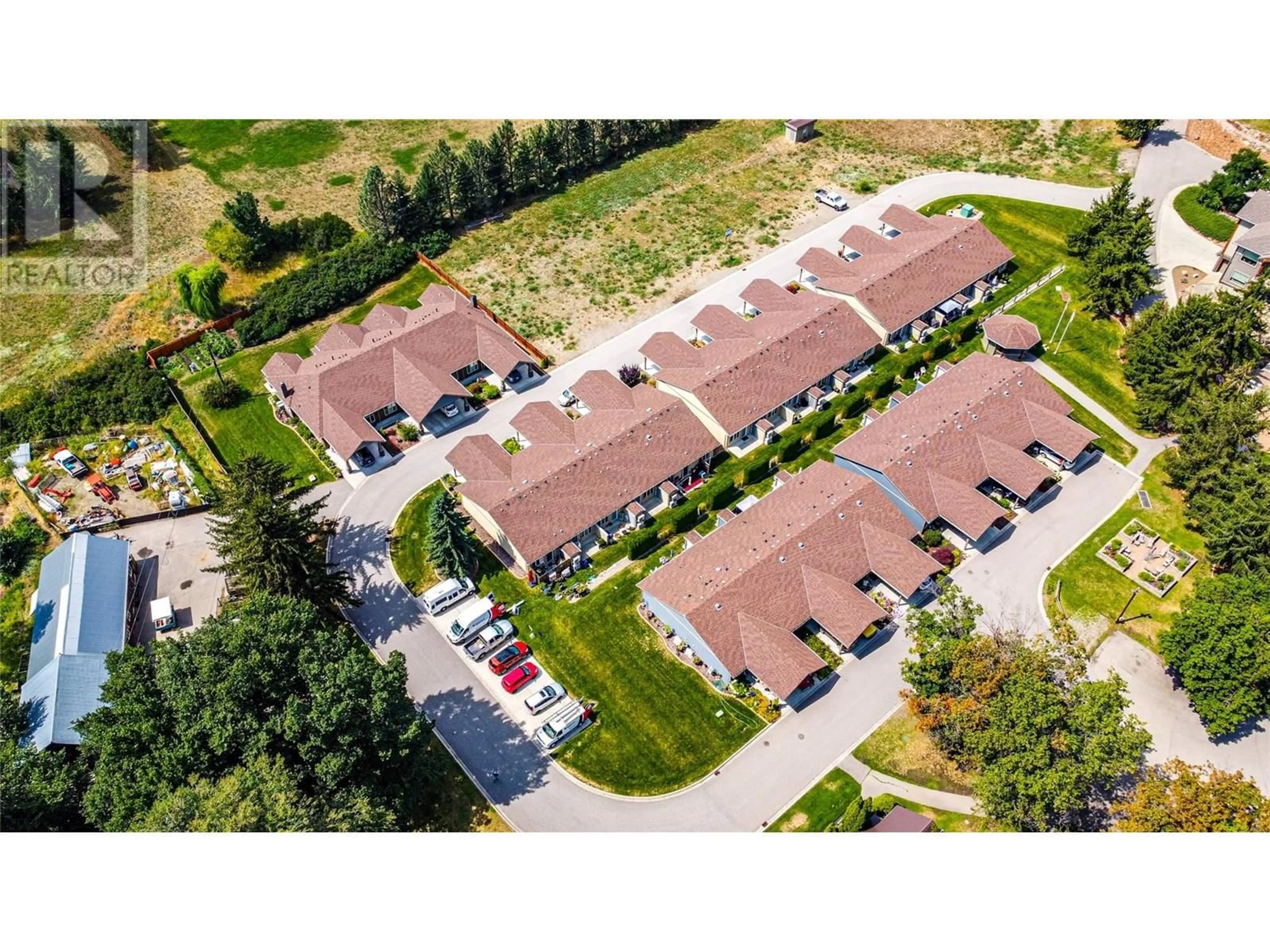A pic from outside/outdoor area/front of a property/back of a property/a pic from drone, street for 37-42 - 9108 MACKIE DRIVE, Coldstream British Columbia V1B1G9