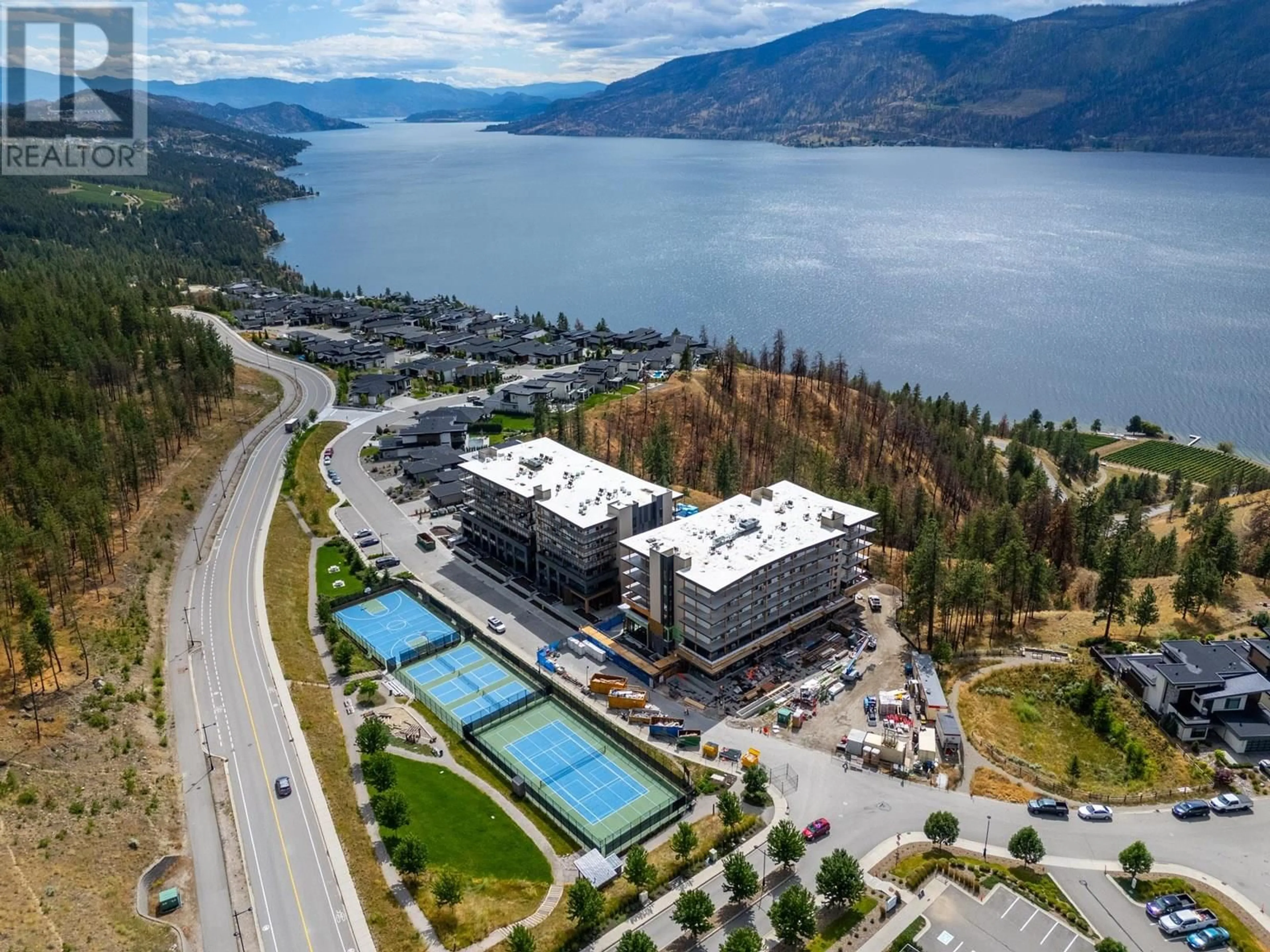 A pic from outside/outdoor area/front of a property/back of a property/a pic from drone, water/lake/river/ocean view for 409 - 9654 BENCHLAND DRIVE, Lake Country British Columbia V4V1N3