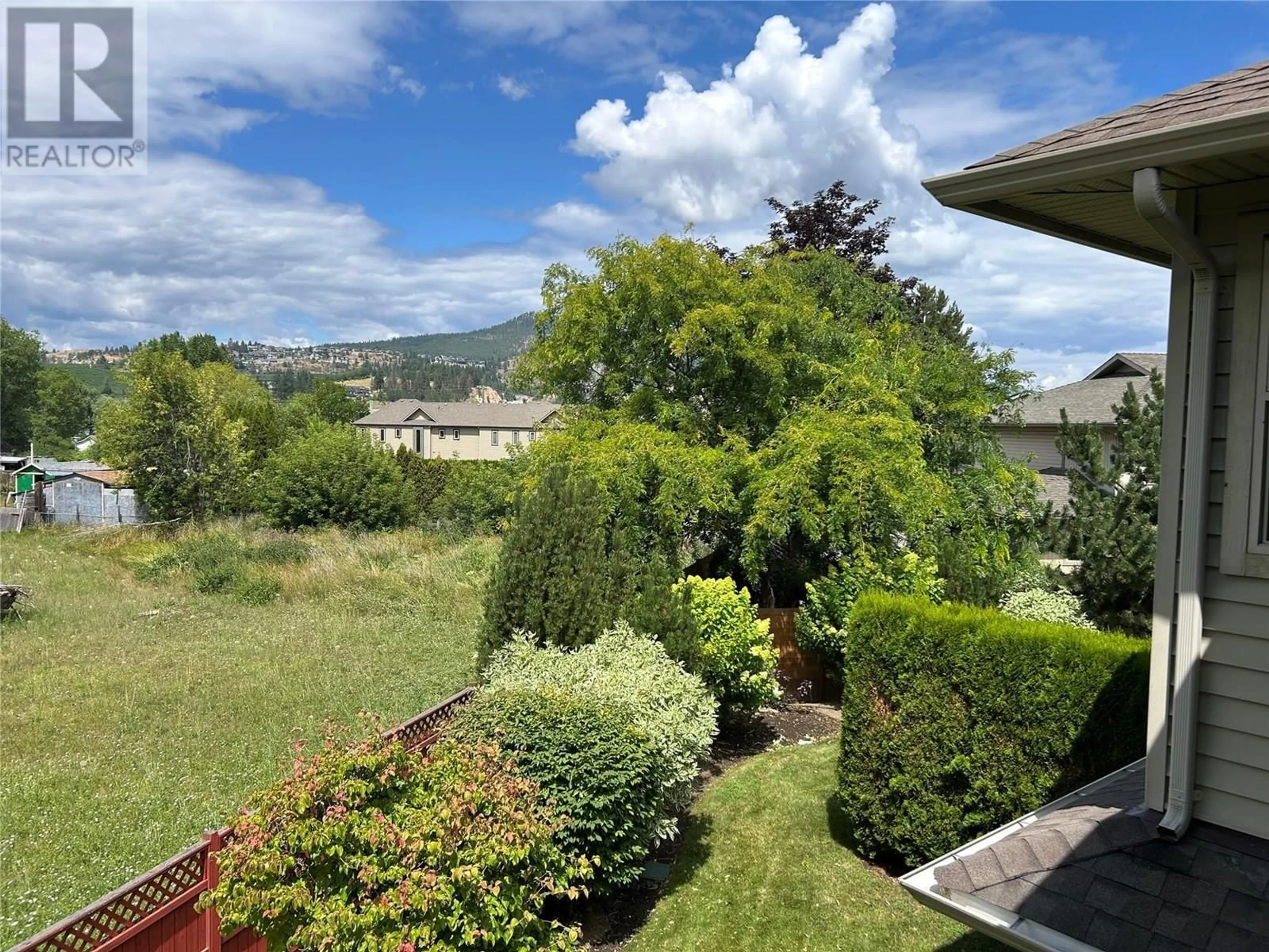 A pic from outside/outdoor area/front of a property/back of a property/a pic from drone, mountain view for 3350 WOODSDALE ROAD, Lake Country British Columbia V4V1X6