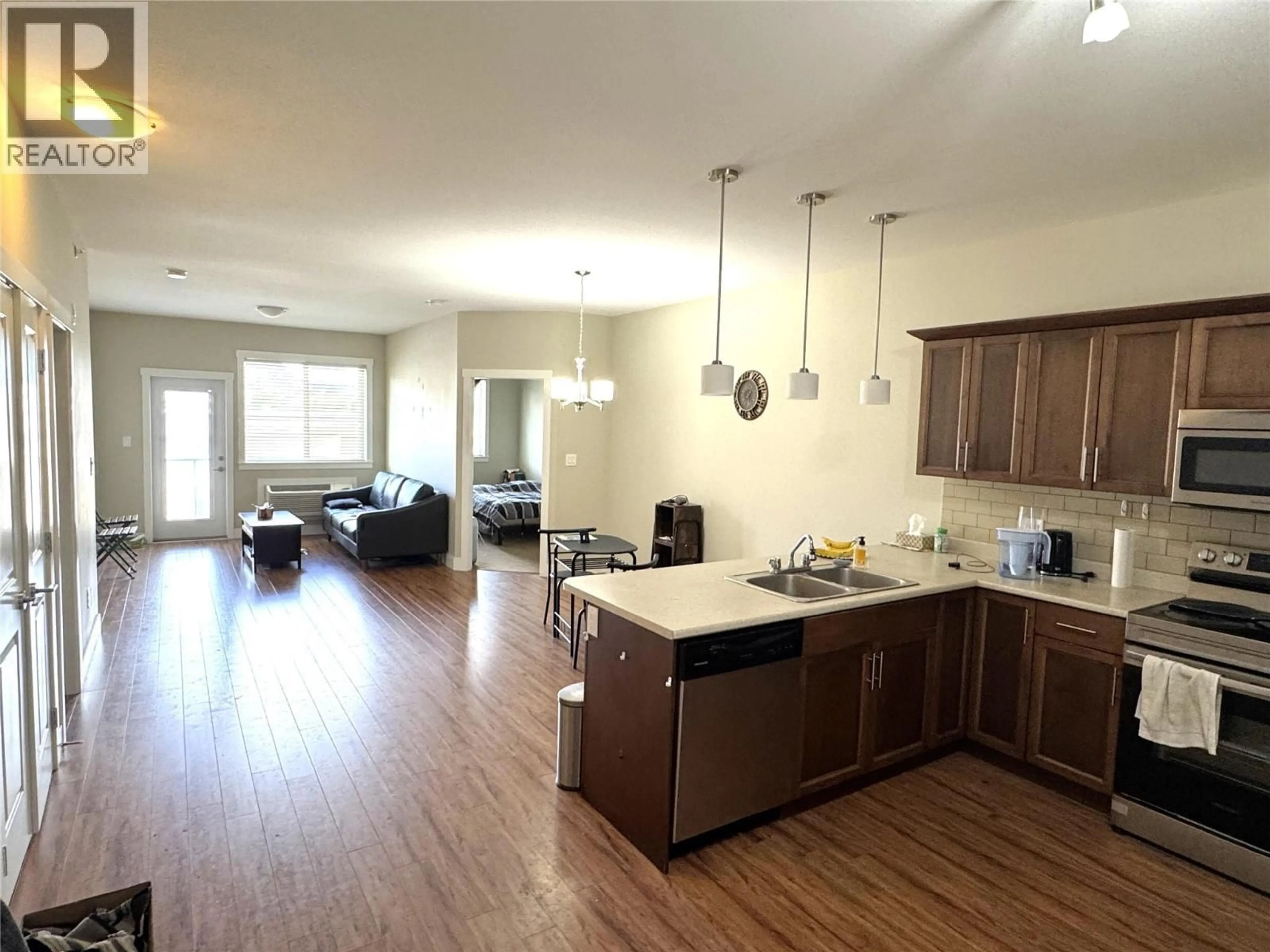 Open concept kitchen, wood/laminate floor for 302 - 1701 MENZIES STREET, Merritt British Columbia V1K1B8