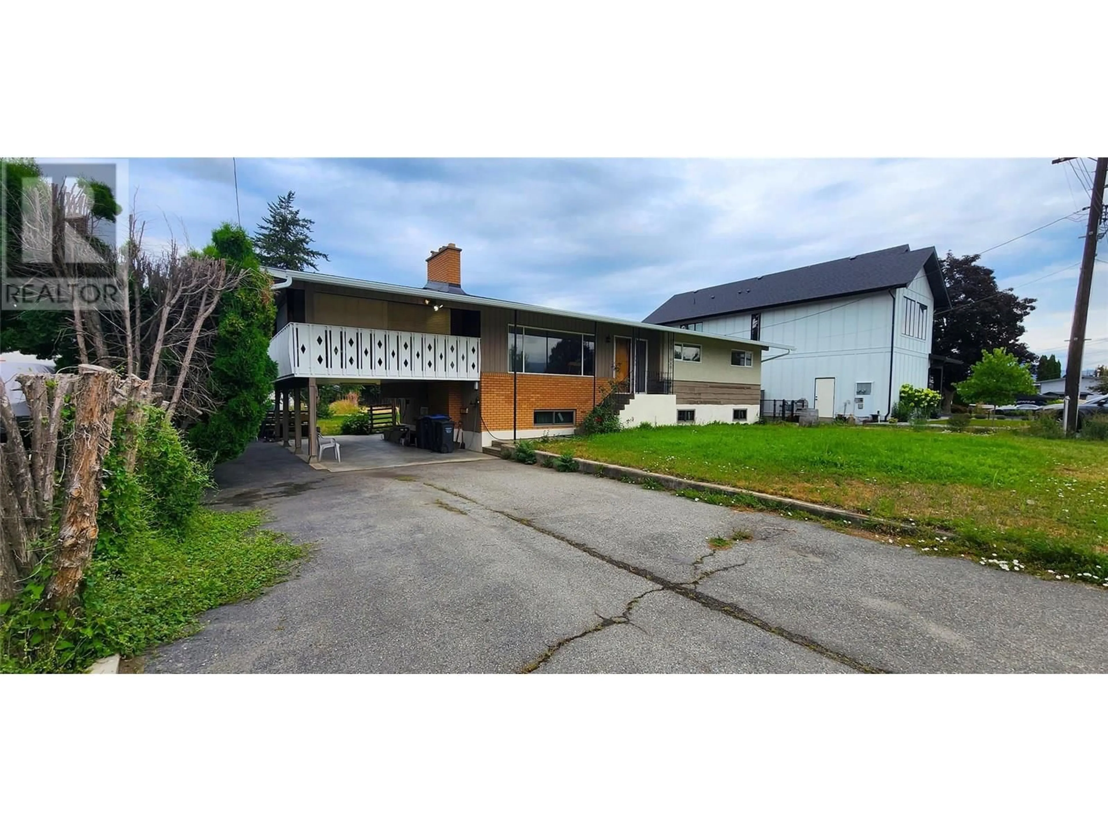 A pic from outside/outdoor area/front of a property/back of a property/a pic from drone, street for 1750 CHAMBERLAIN ROAD, Kelowna British Columbia V1W3P4