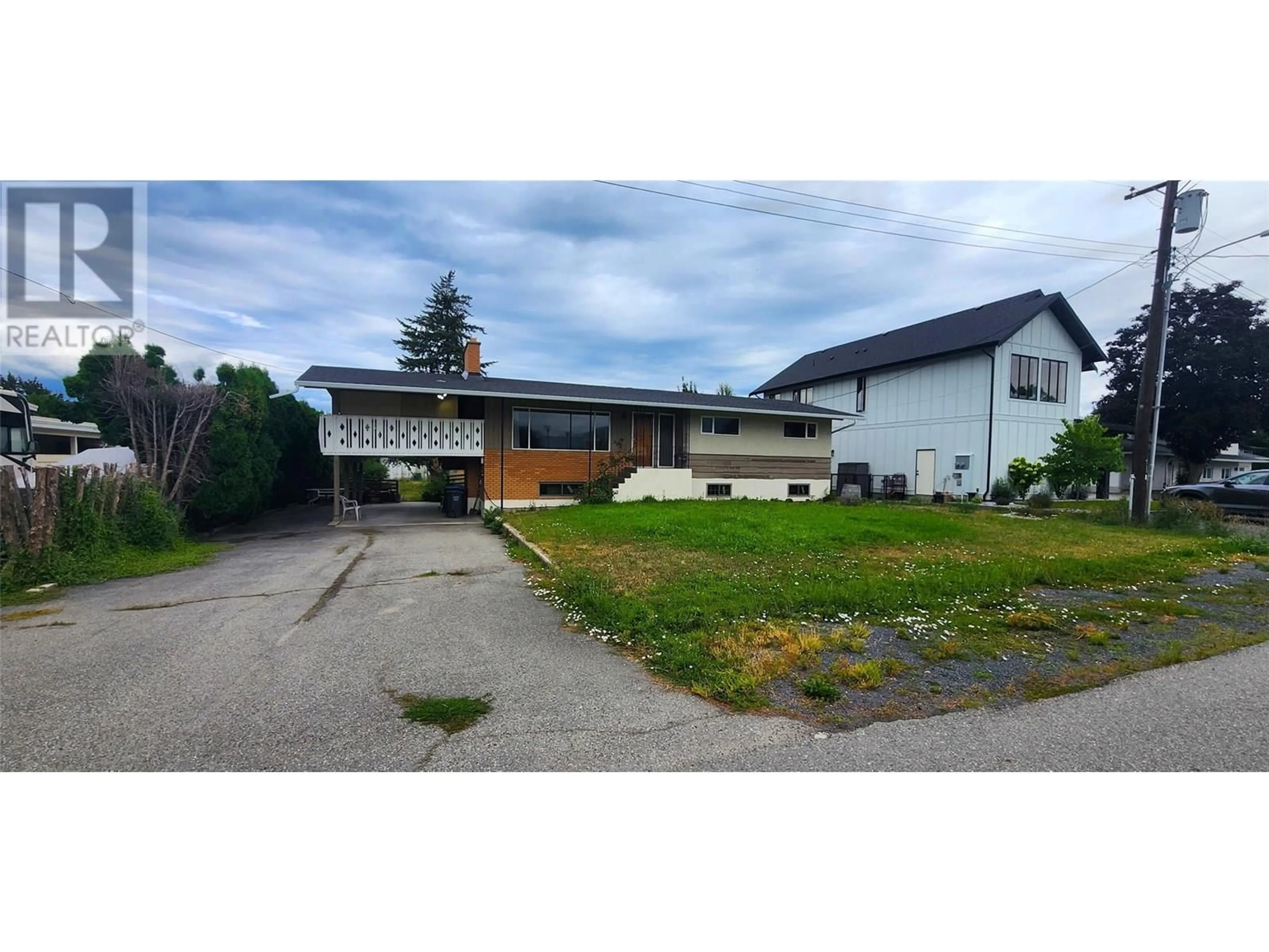 A pic from outside/outdoor area/front of a property/back of a property/a pic from drone, street for 1750 CHAMBERLAIN ROAD, Kelowna British Columbia V1W3P4
