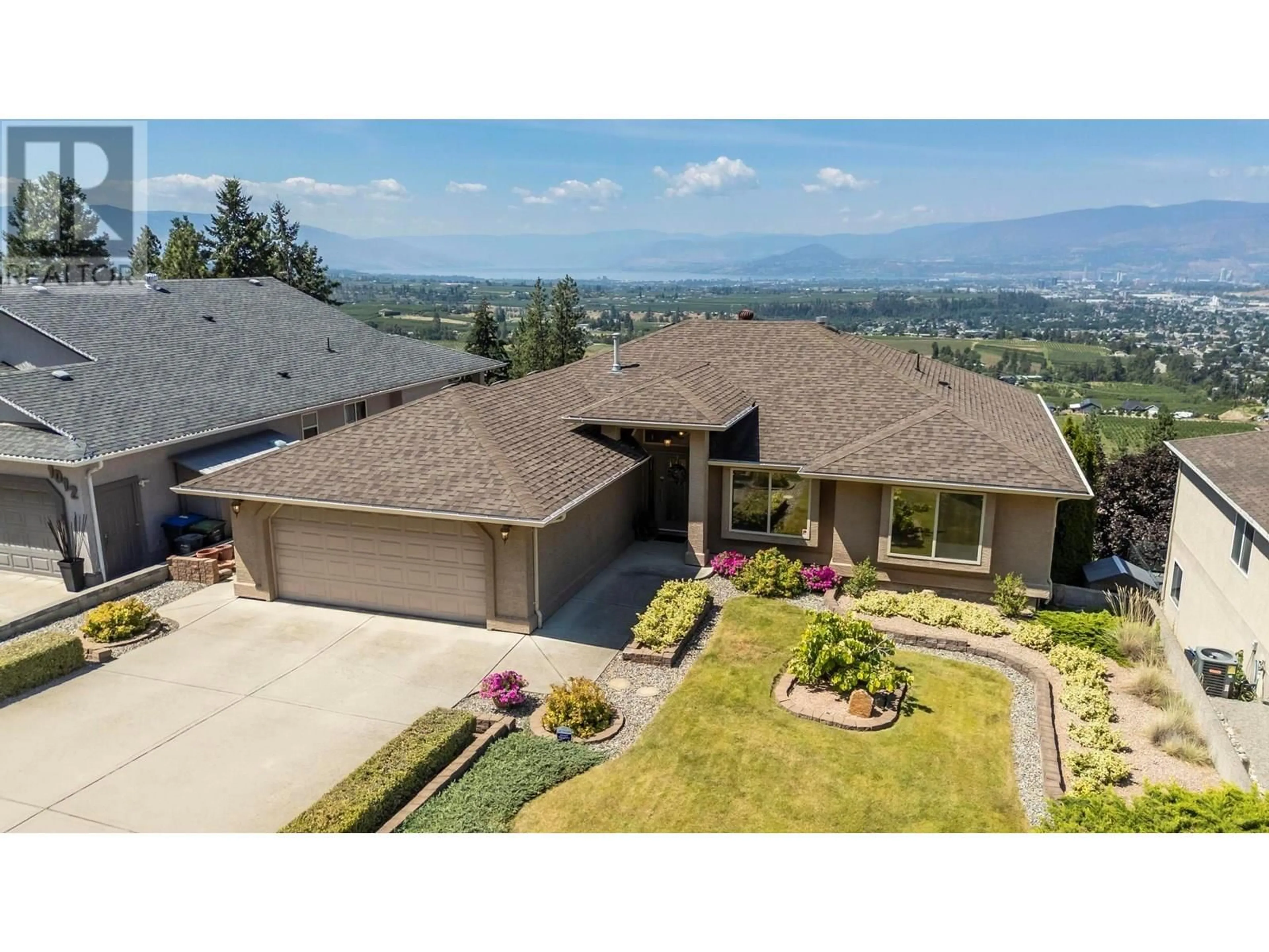 A pic from outside/outdoor area/front of a property/back of a property/a pic from drone, mountain view for 1000 LONE PINE DRIVE, Kelowna British Columbia V1P1M7