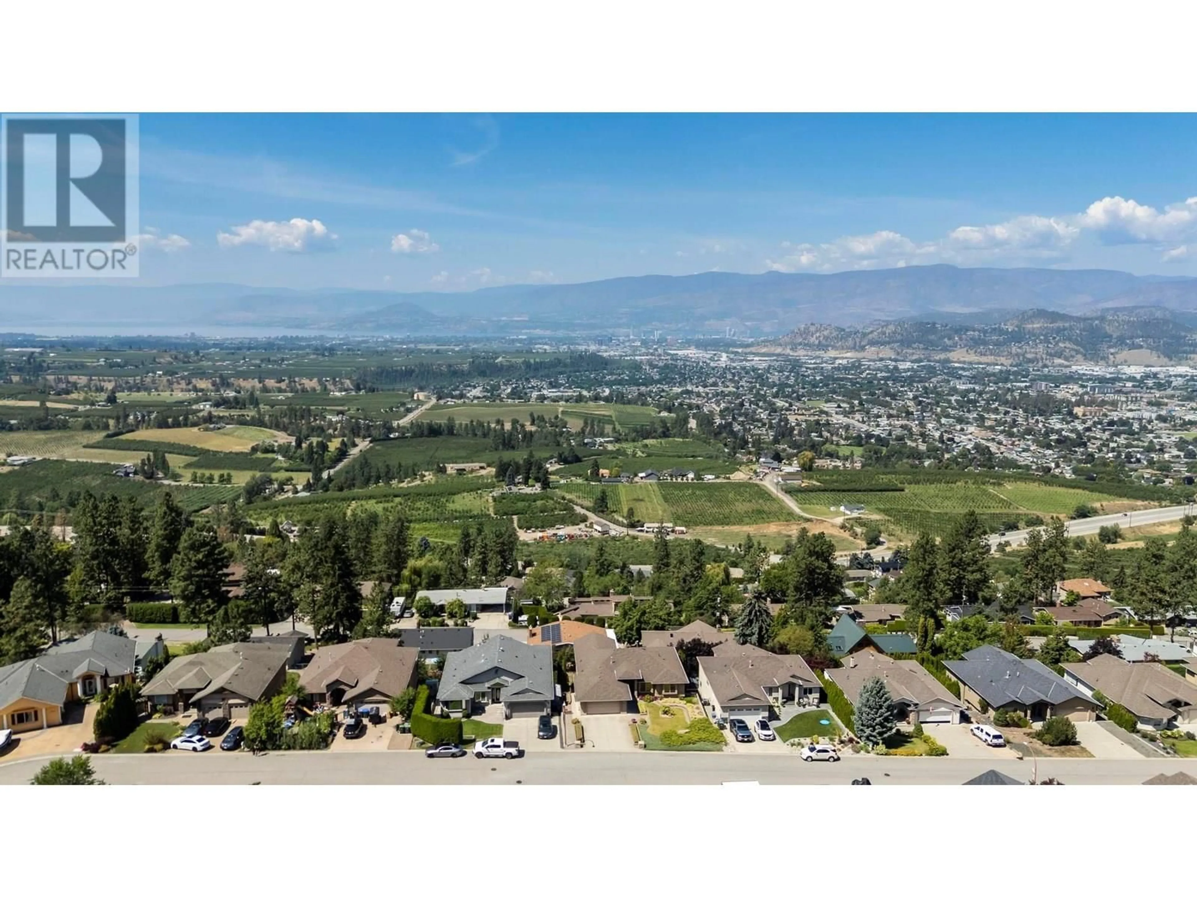 A pic from outside/outdoor area/front of a property/back of a property/a pic from drone, mountain view for 1000 LONE PINE DRIVE, Kelowna British Columbia V1P1M7