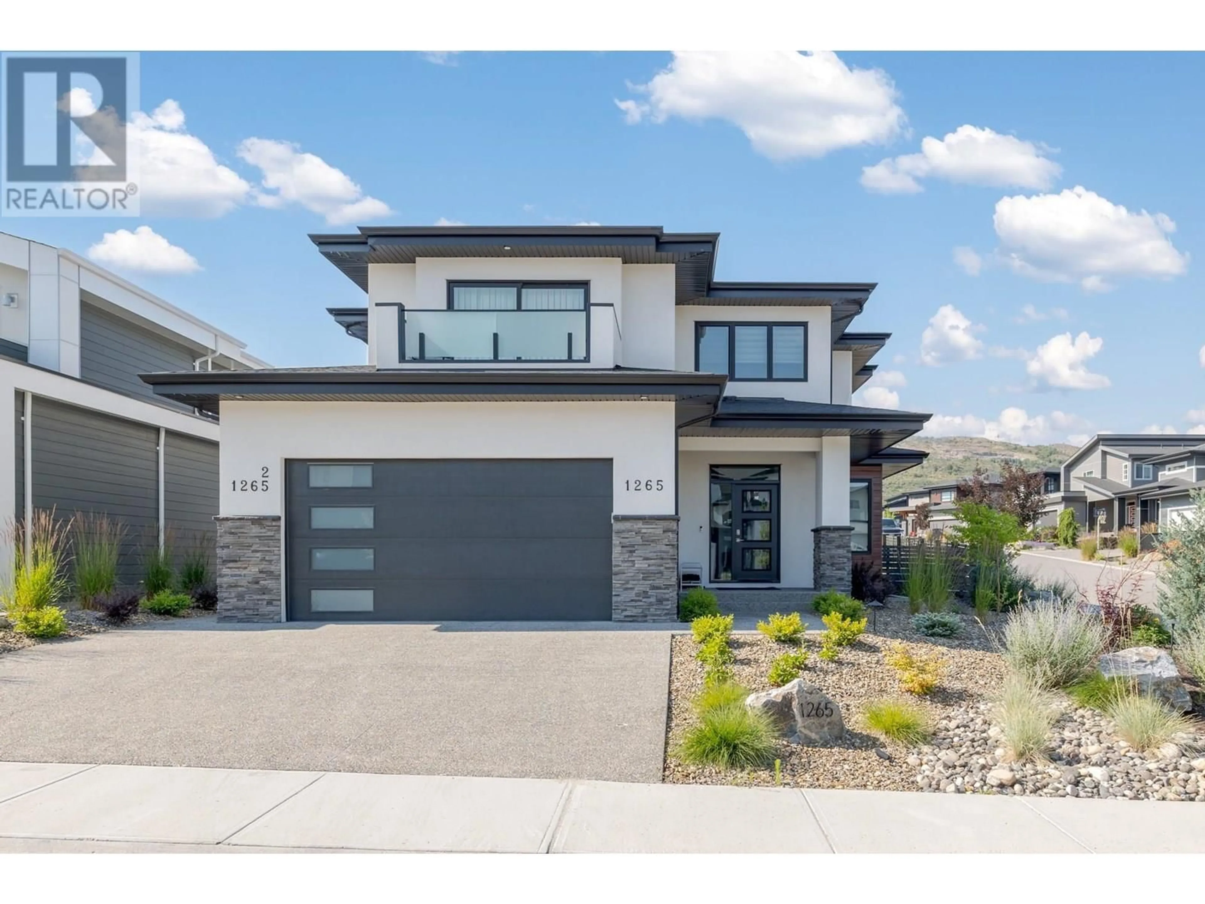 Home with brick exterior material, street for 1265 PONDS AVENUE, Kelowna British Columbia V1W5N1