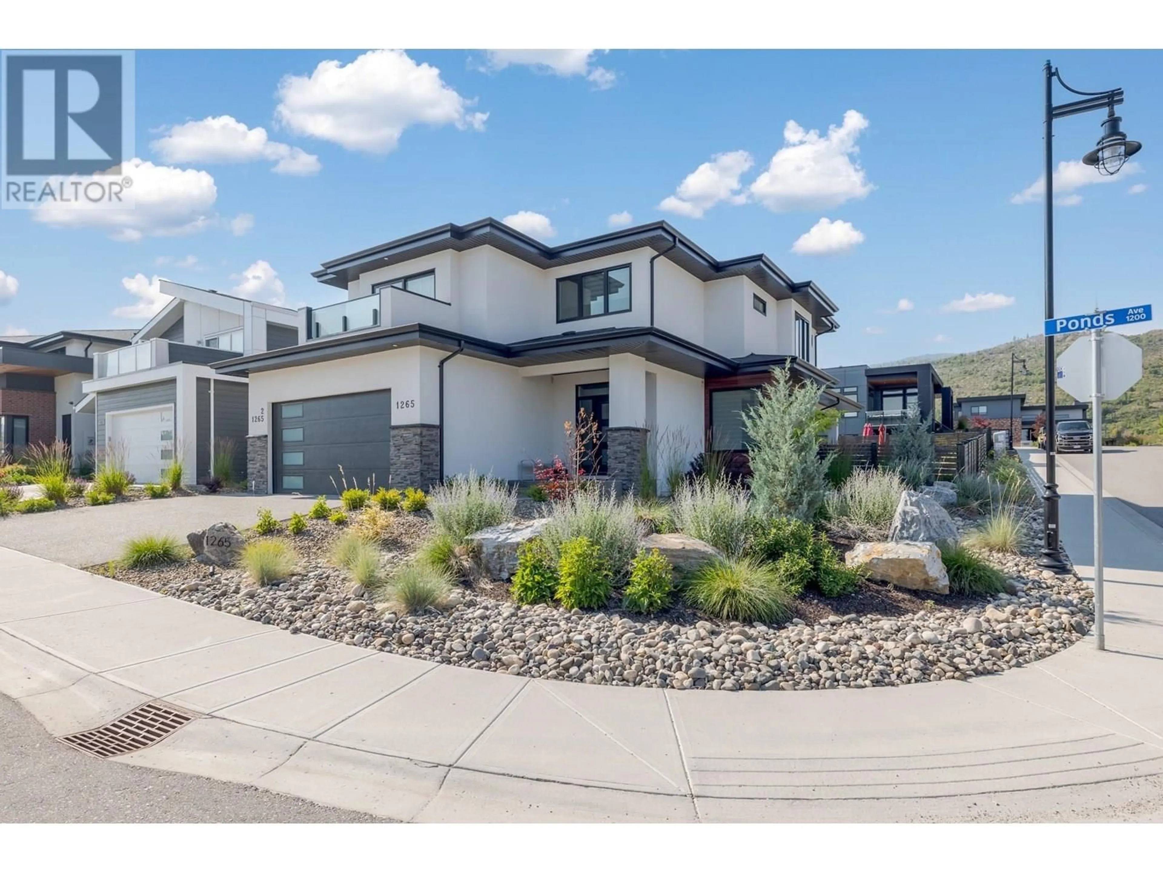 Home with brick exterior material, street for 1265 PONDS AVENUE, Kelowna British Columbia V1W5N1