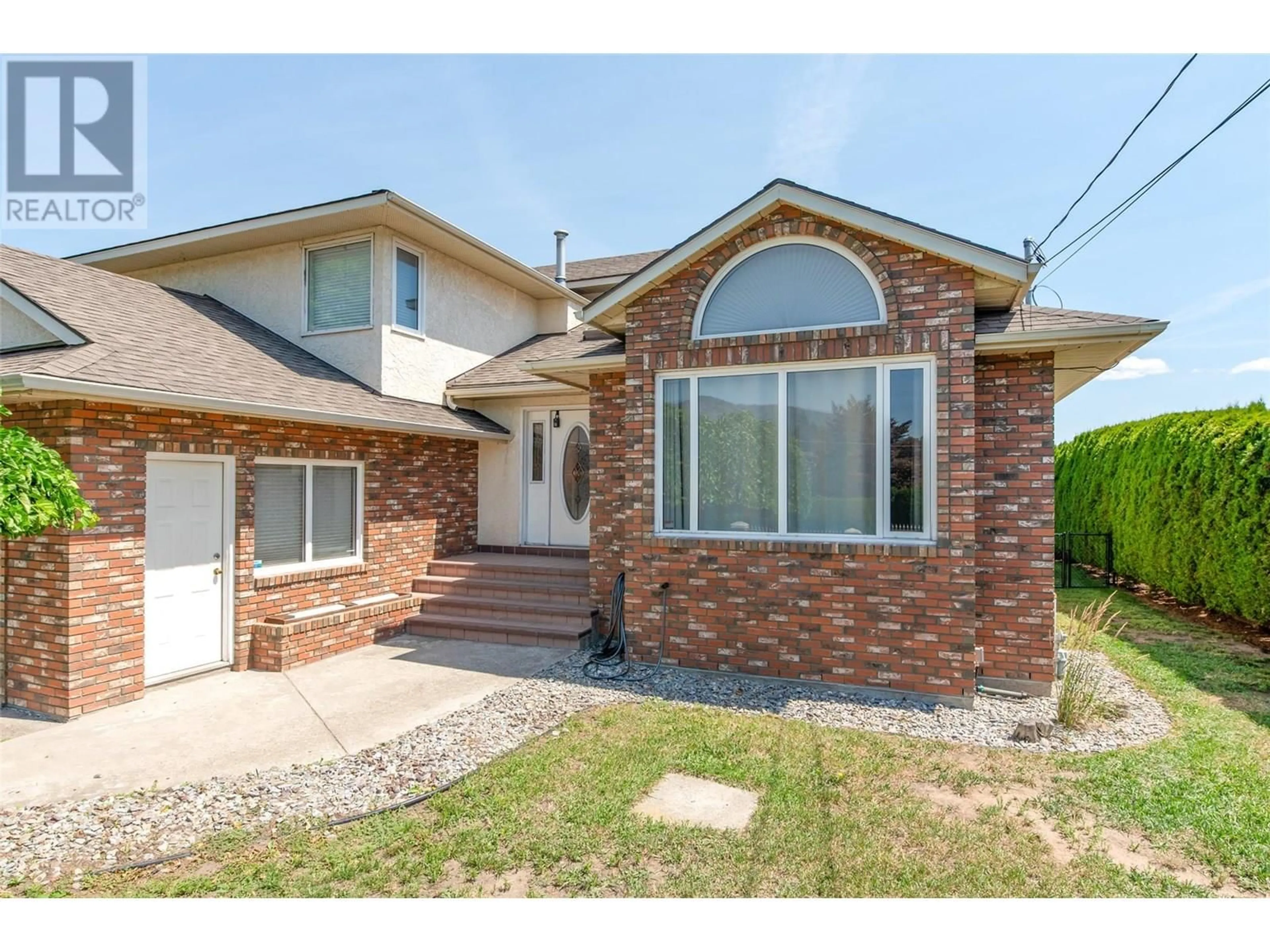 Home with brick exterior material, street for 2529 THACKER DRIVE, West Kelowna British Columbia V1Z1W2