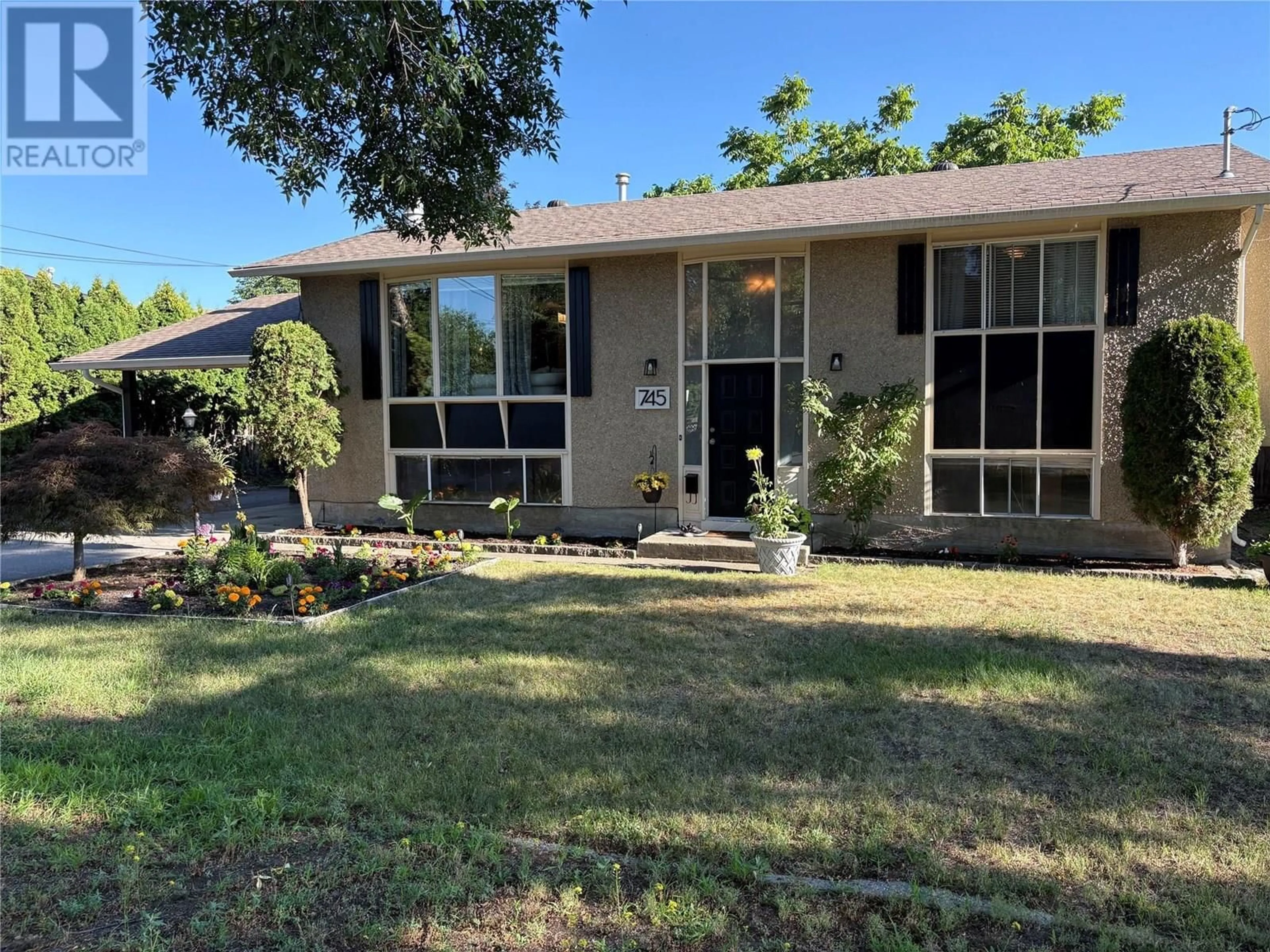 Home with vinyl exterior material, street for 745 DUNDEE ROAD, Kelowna British Columbia V1X1R3