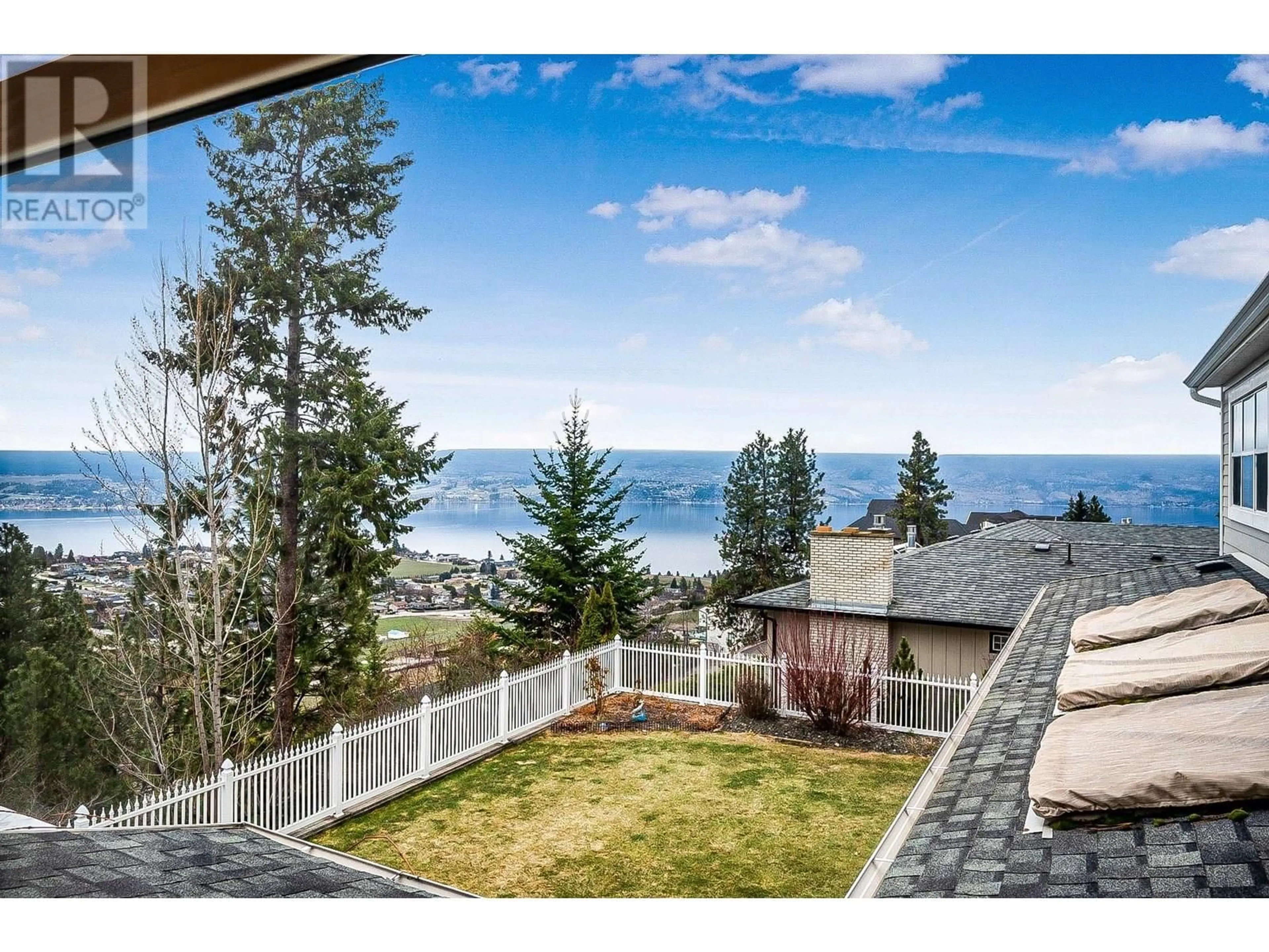 A pic from outside/outdoor area/front of a property/back of a property/a pic from drone, water/lake/river/ocean view for 1202 TREVOR DRIVE, West Kelowna British Columbia V1Z3K7