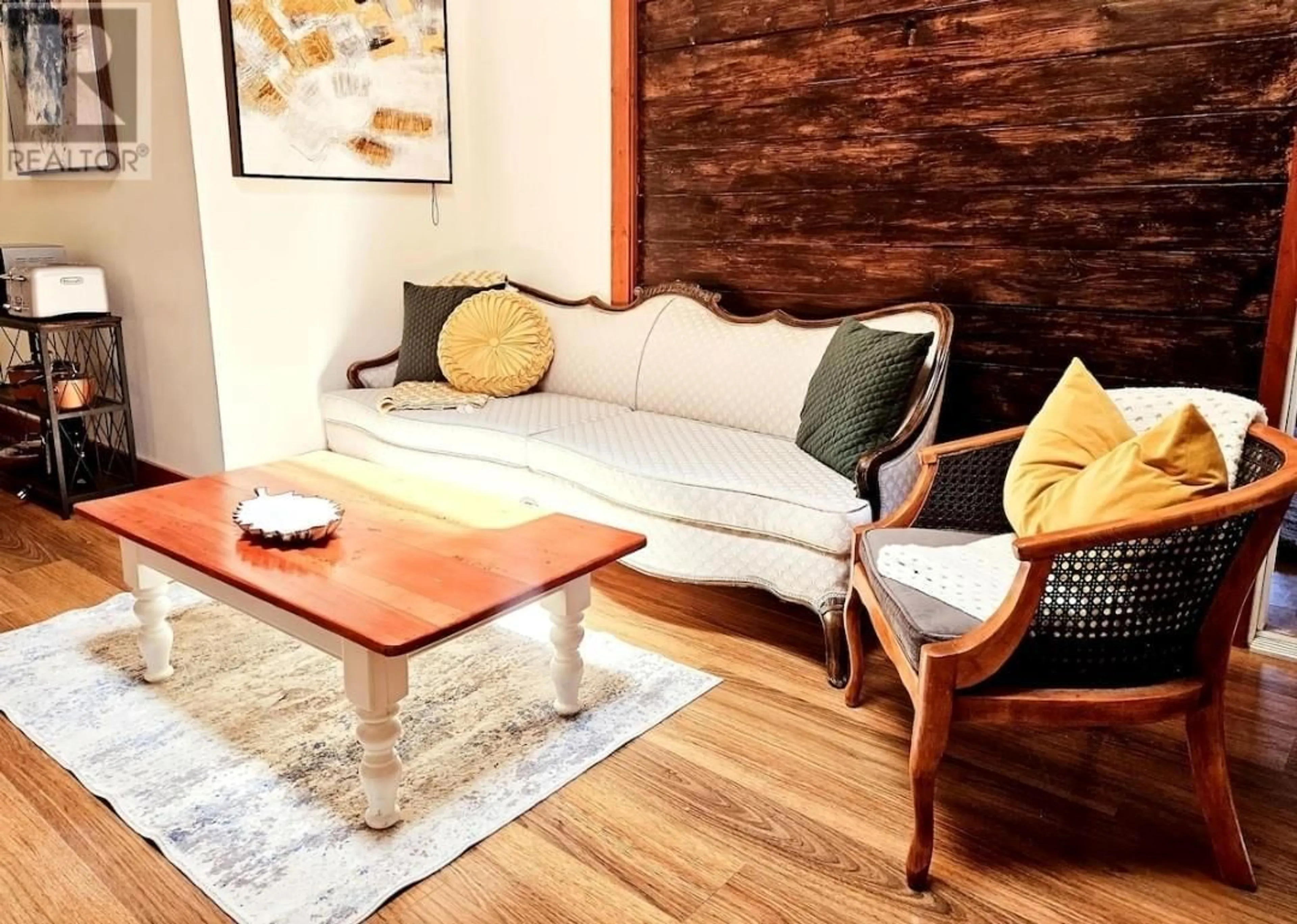 Living room with furniture, wood/laminate floor for 2000 POTTERY ROAD, Vernon British Columbia V1T8M1