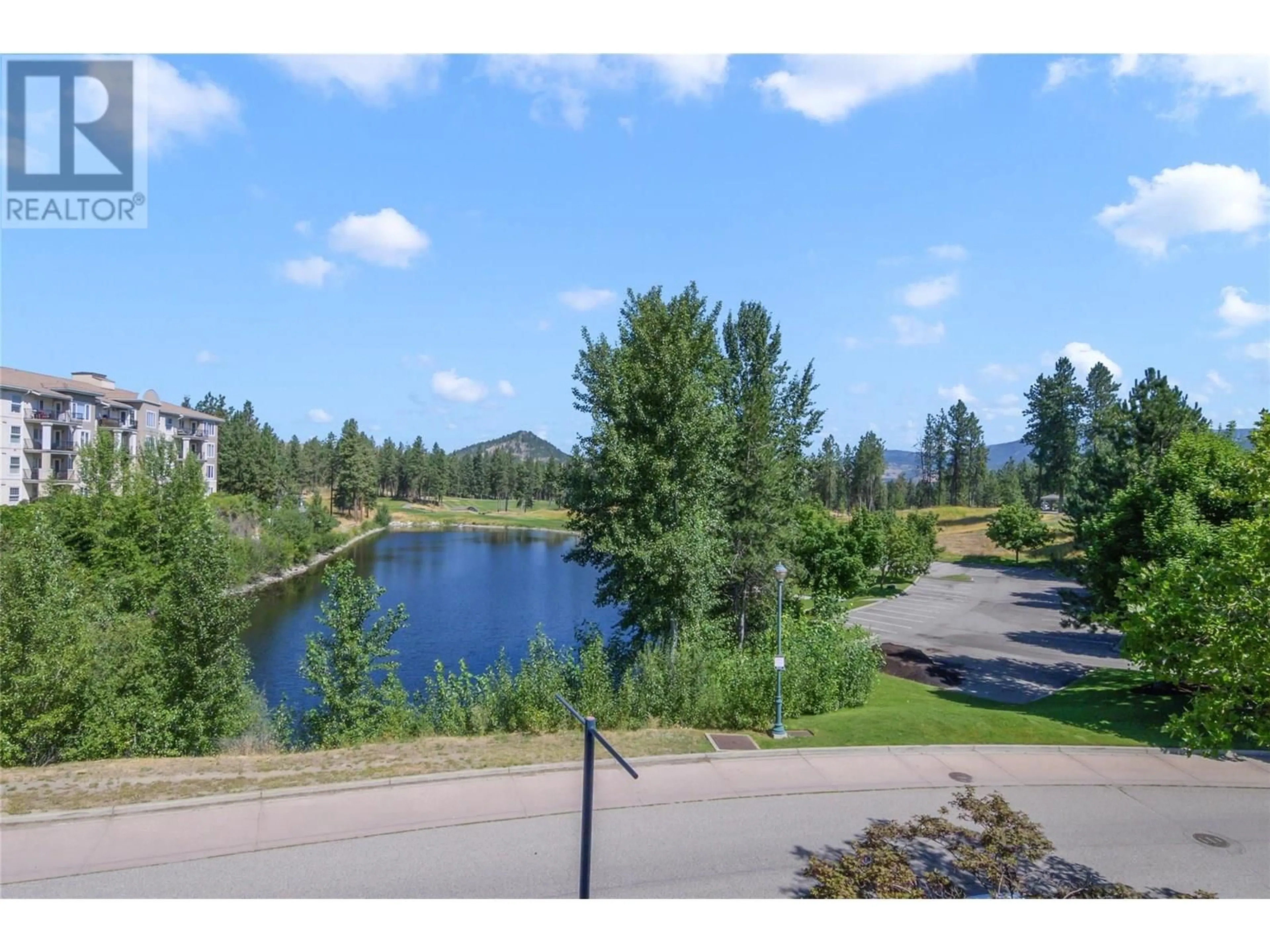 A pic from outside/outdoor area/front of a property/back of a property/a pic from drone, water/lake/river/ocean view for 201 - 3185 VIA CENTRALE DRIVE, Kelowna British Columbia V1V2A7