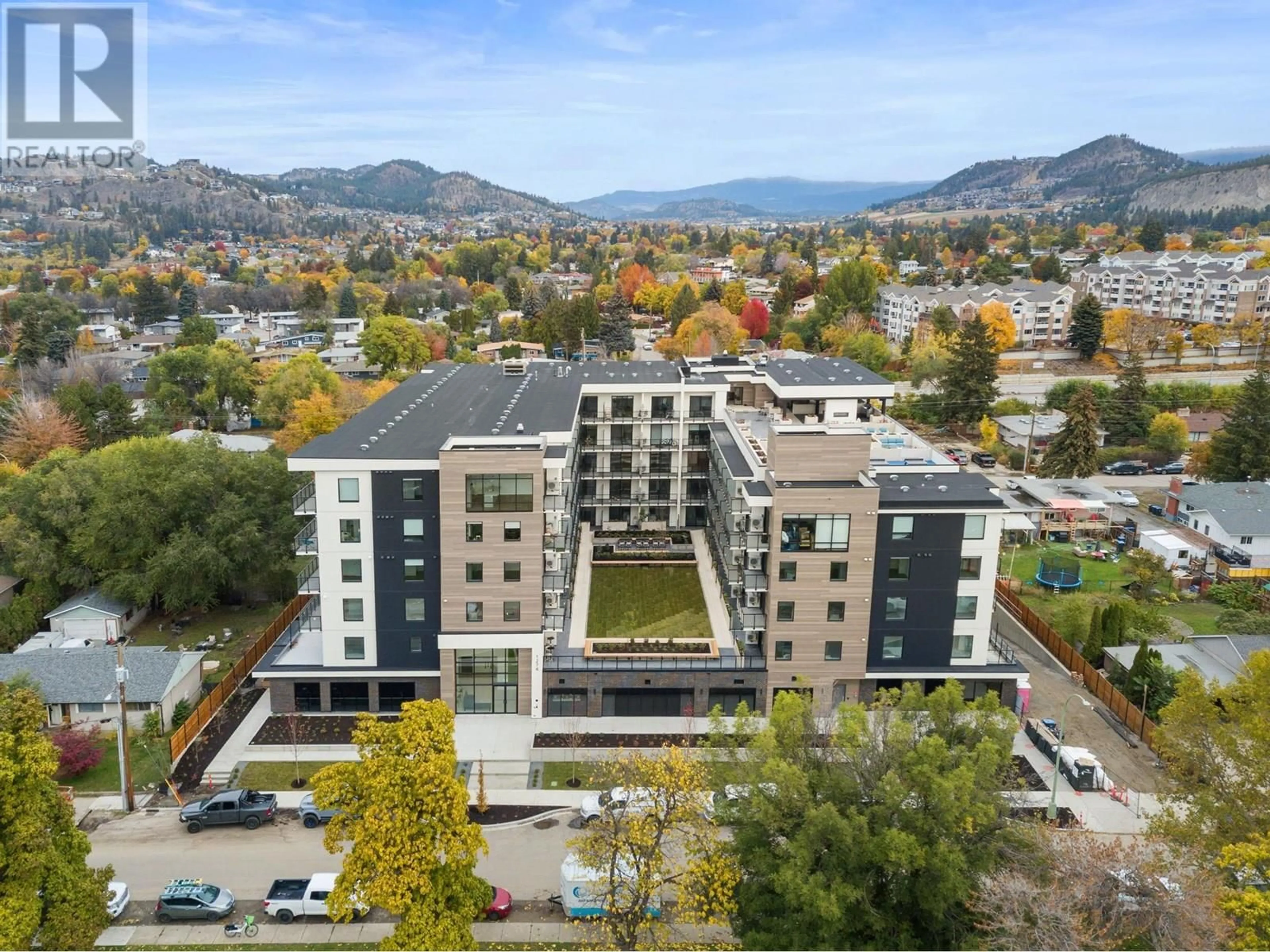A pic from outside/outdoor area/front of a property/back of a property/a pic from drone, mountain view for 505 - 1274 DEVONSHIRE AVENUE, Kelowna British Columbia V1Y0M2