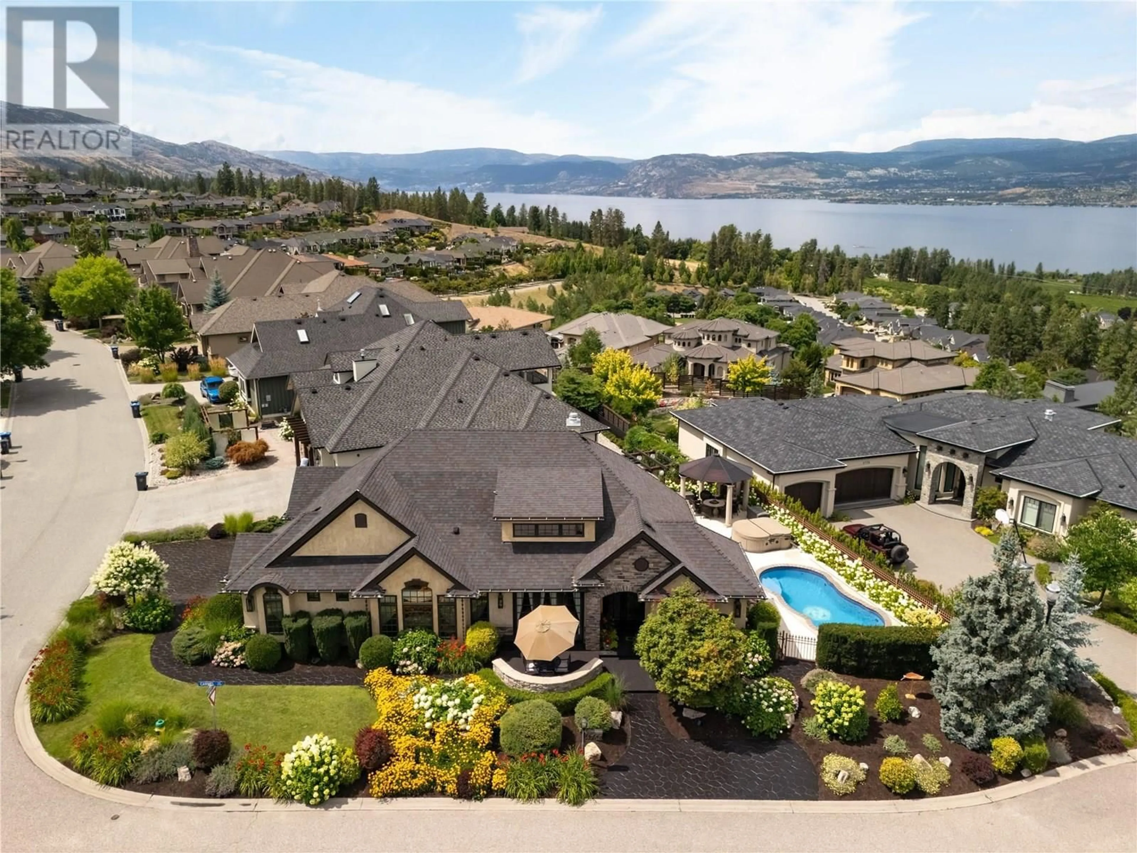 A pic from outside/outdoor area/front of a property/back of a property/a pic from drone, water/lake/river/ocean view for 4768 CARMEL CRESCENT, Kelowna British Columbia V1W5B9